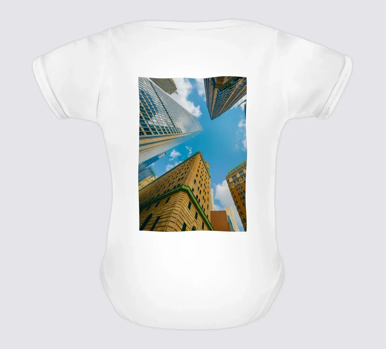 view of the sky from under a tall building short-sleeve baby romper by PASMING
