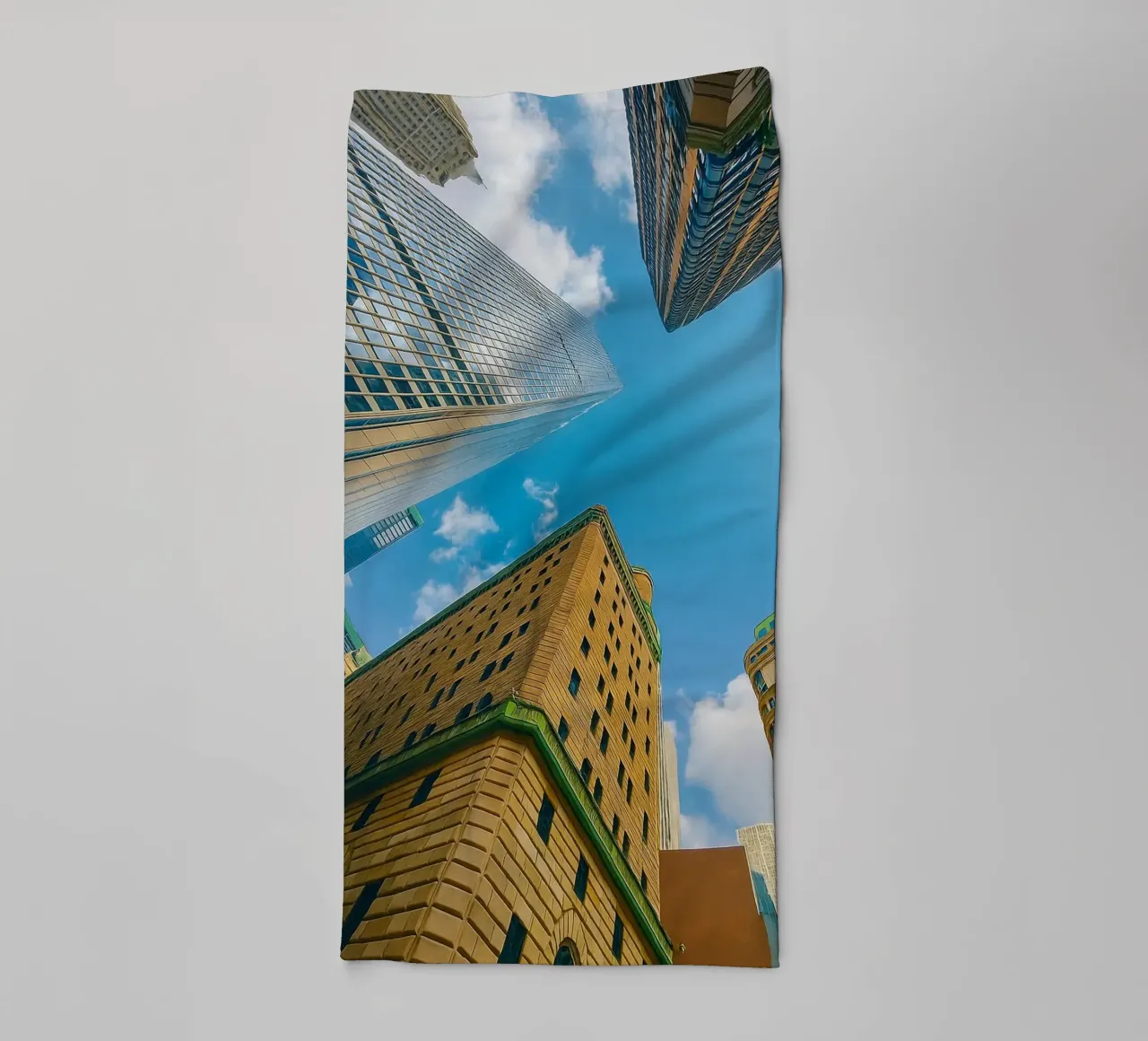 view of the sky from under a tall building towel by PASMING