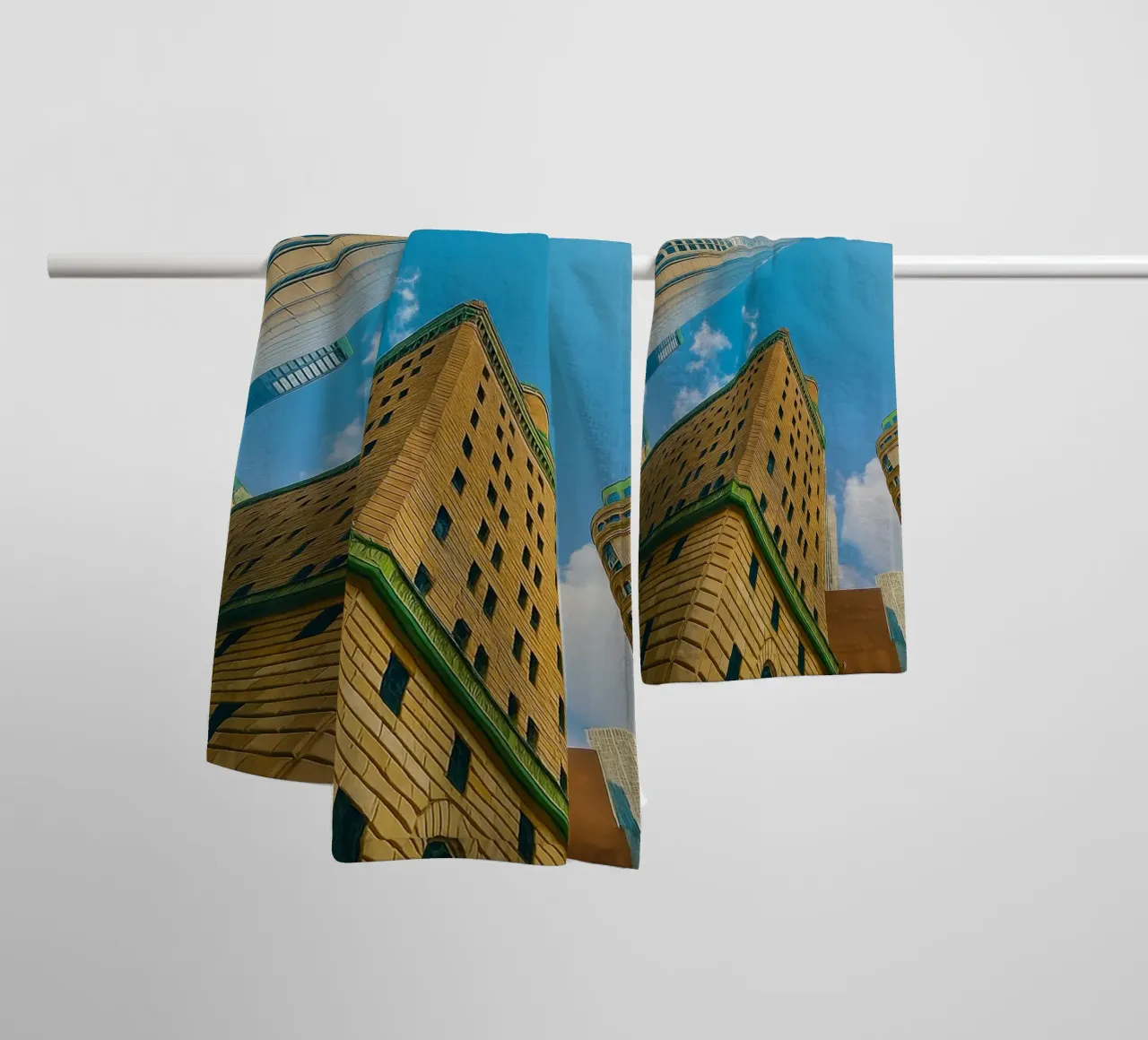 view of the sky from under a tall building towel by PASMING