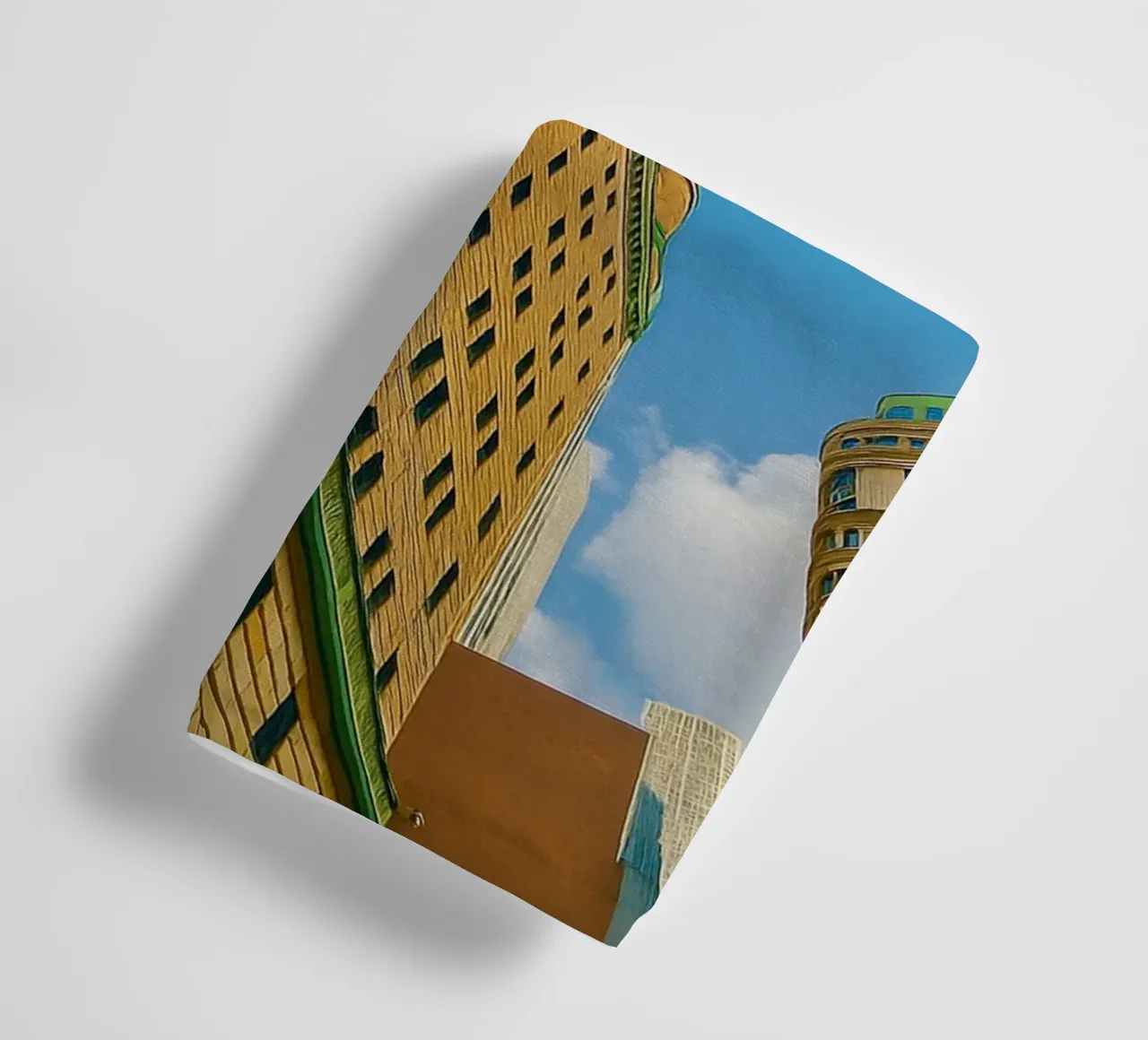 view of the sky from under a tall building towel by PASMING