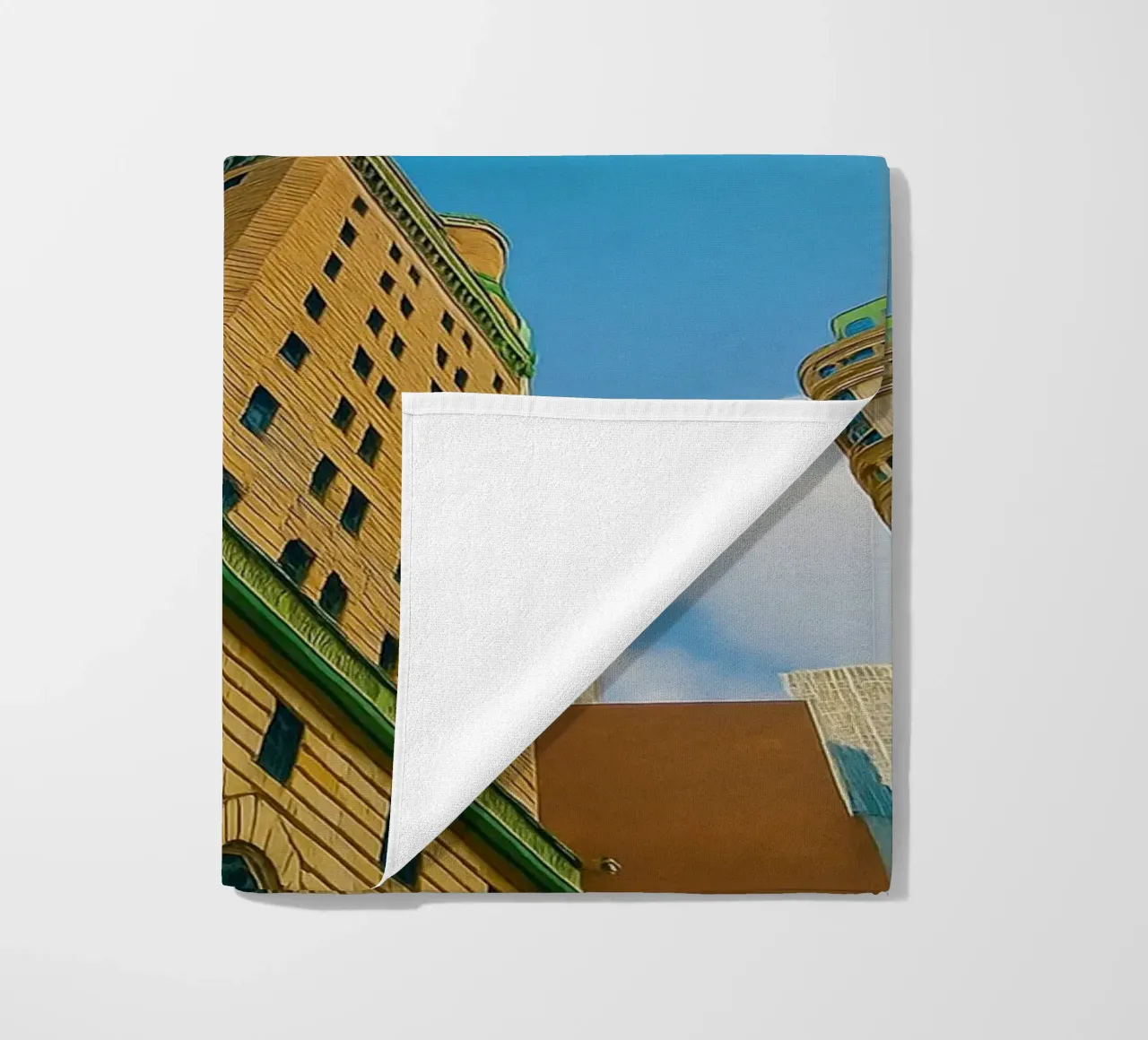 view of the sky from under a tall building beach towel by PASMING