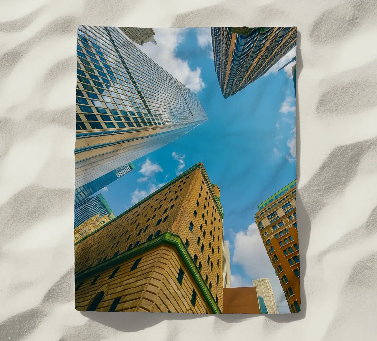 view of the sky from under a tall building beach towel by PASMING