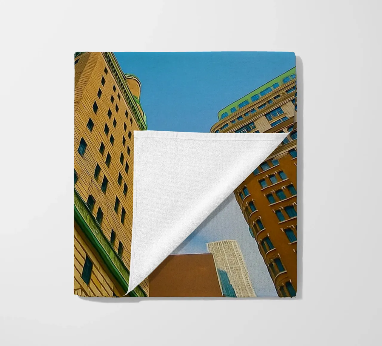view of the sky from under a tall building beach towel by PASMING
