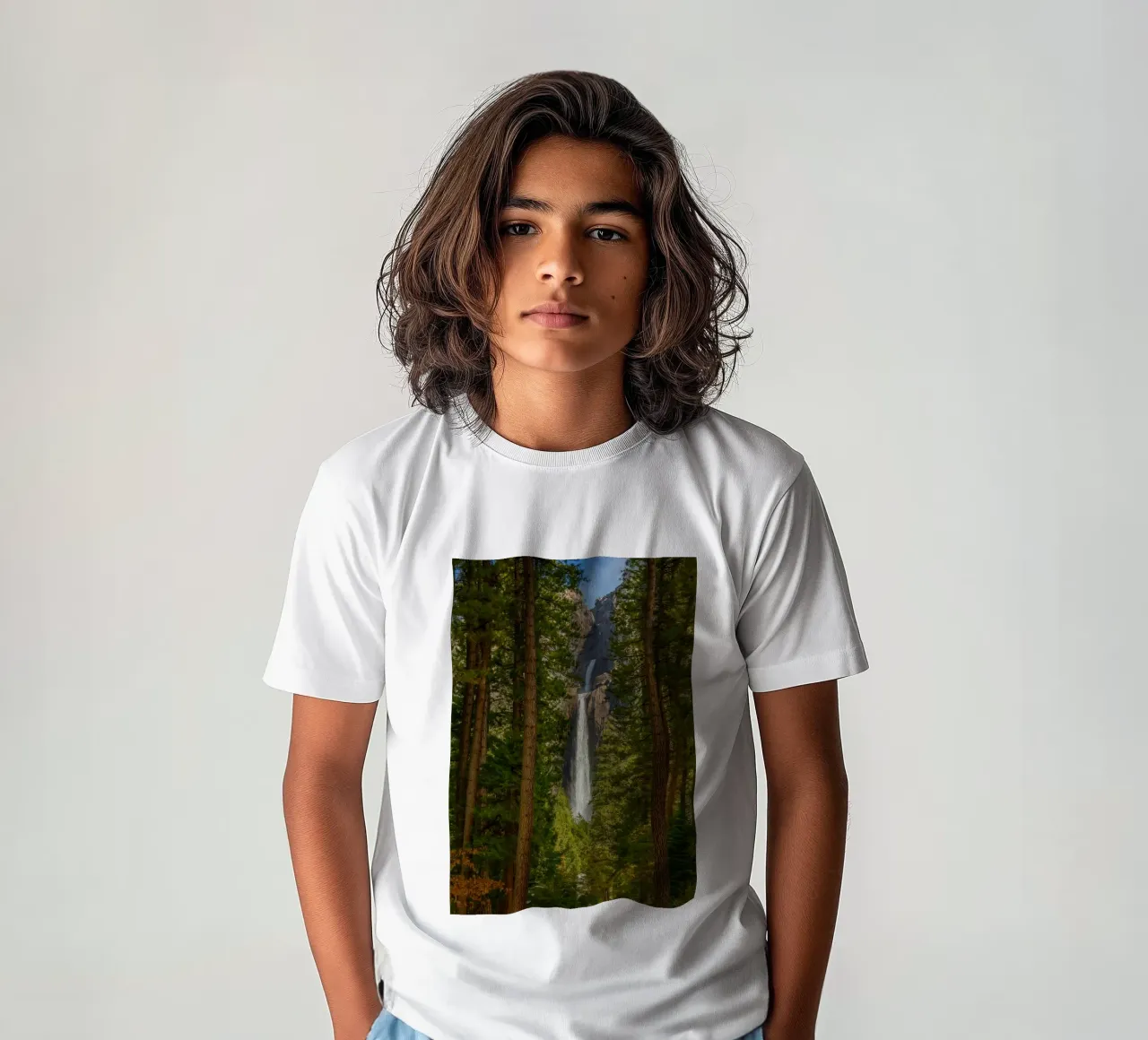 view of a waterfall in the forest kids t-shirt by PASMING