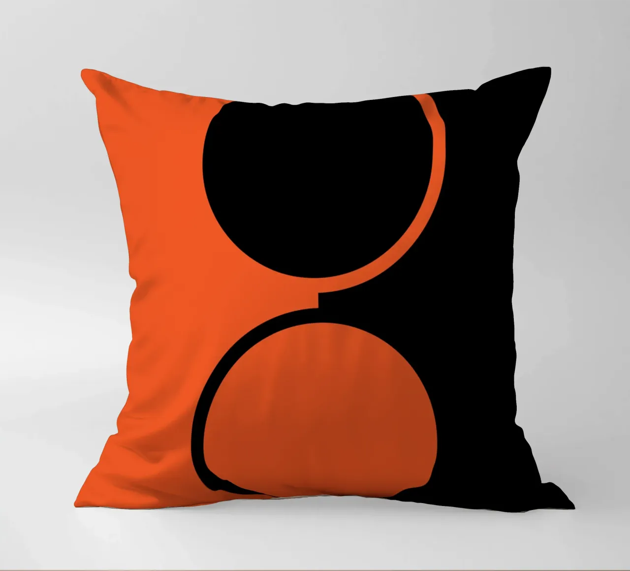 due cerchi arancione nero cuscino da SADELA