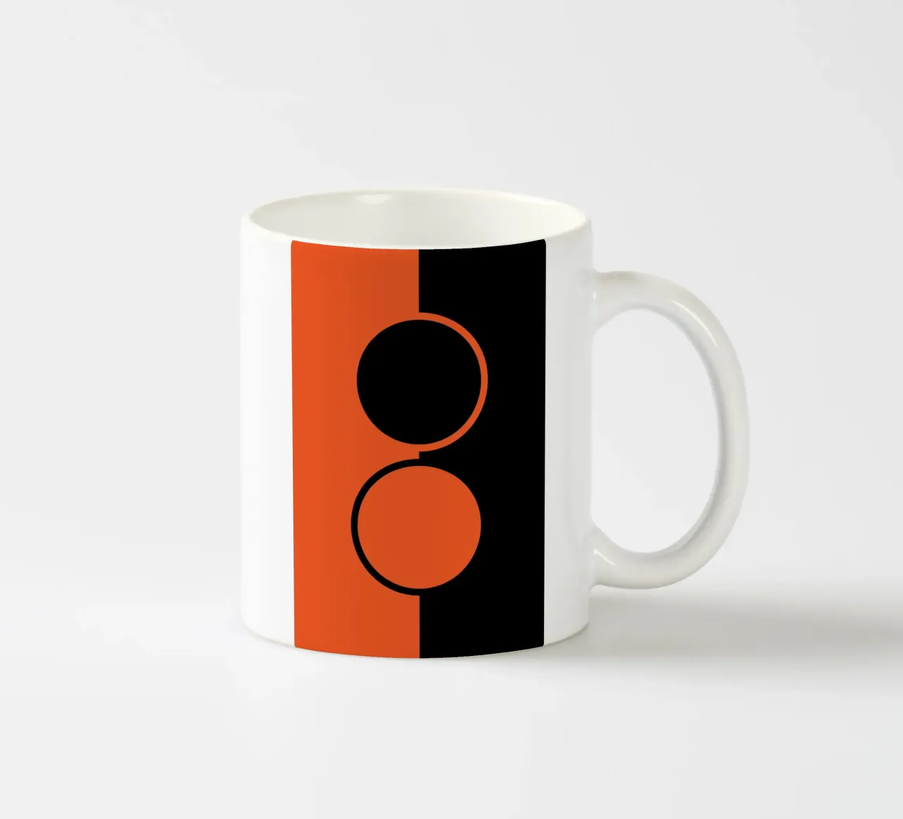 due cerchi arancione nero tazza in ceramica da SADELA