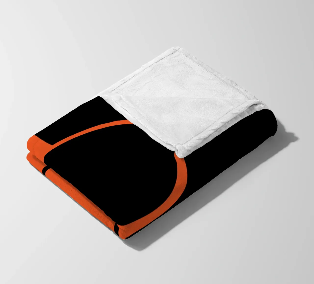 due cerchi arancione nero coperta in pile da SADELA