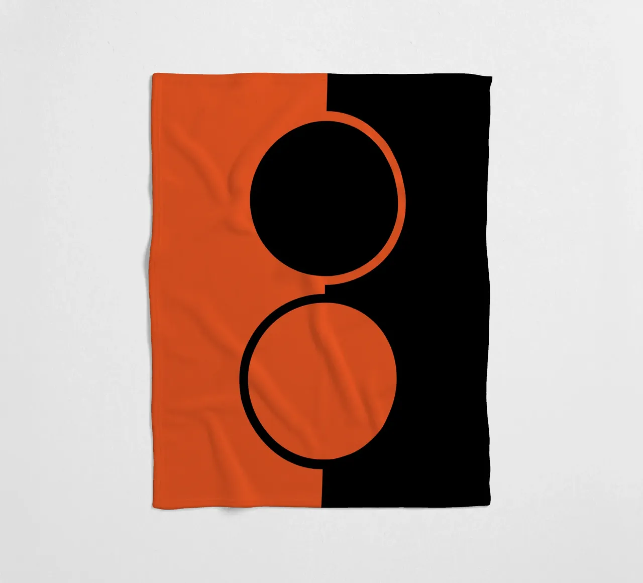 due cerchi arancione nero coperta in pile da SADELA