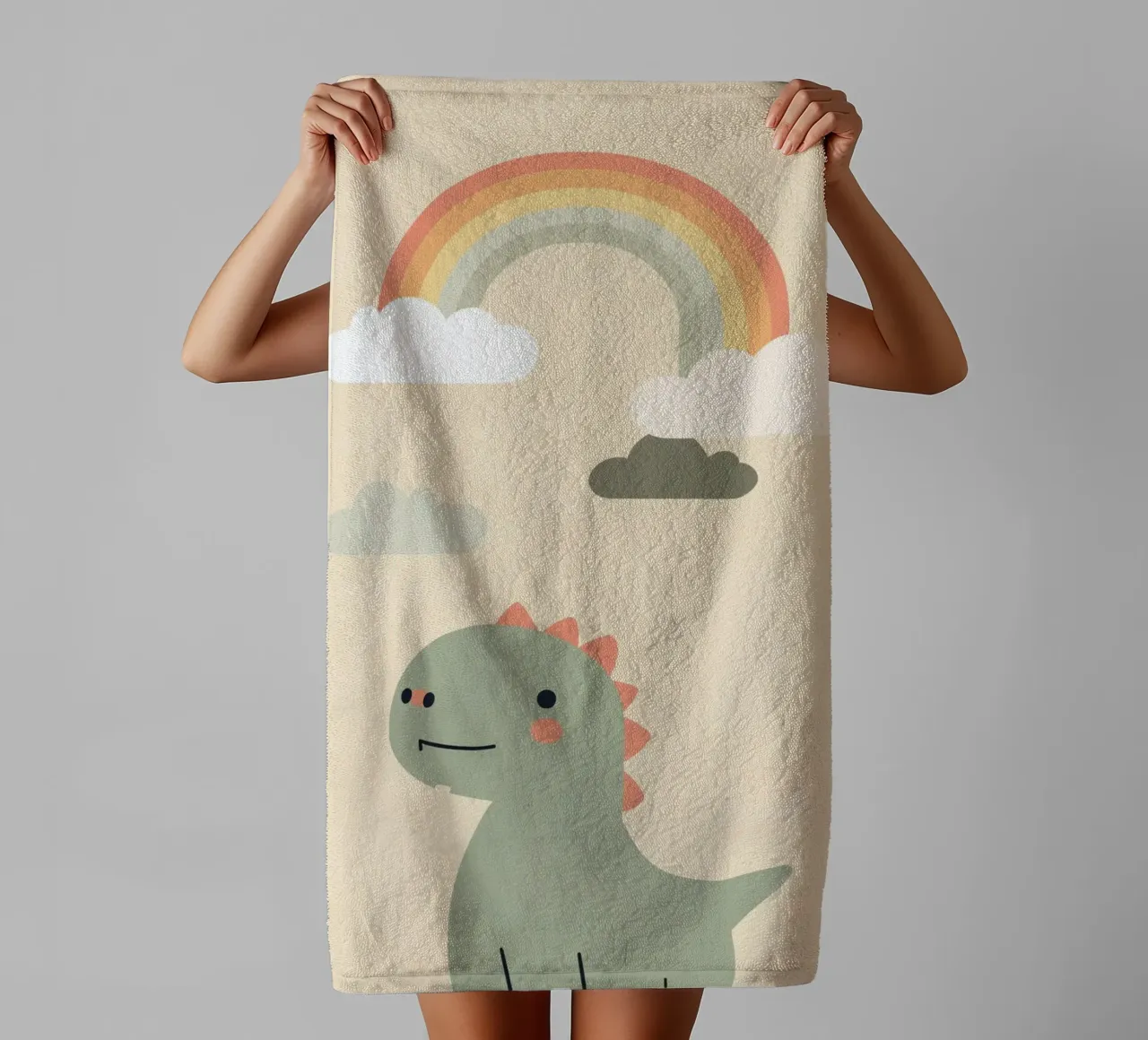 Illustrazione di un simpatico dinosauro e di un arcobaleno asciugamano da bagno da DesignDoodle