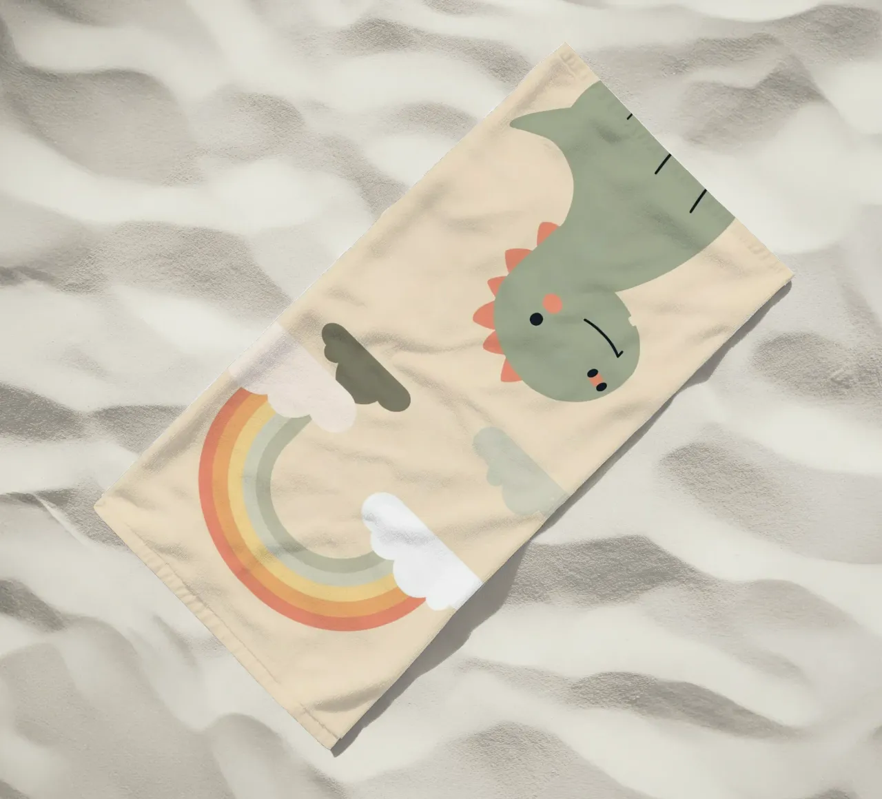 Illustrazione di un simpatico dinosauro e di un arcobaleno telo mare da DesignDoodle