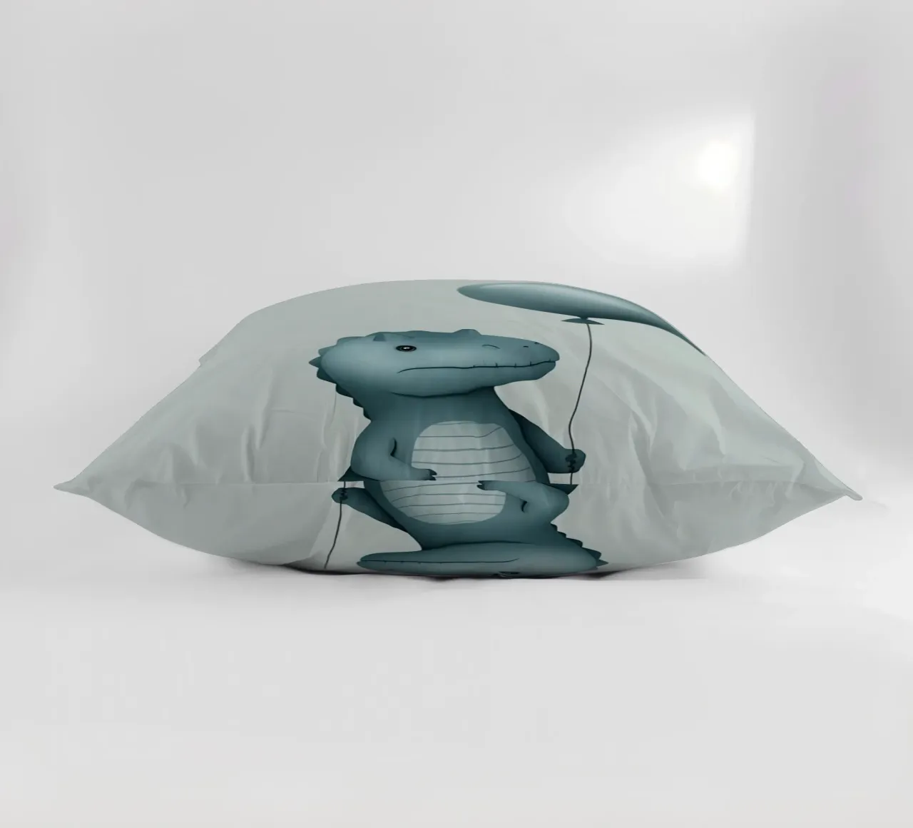 Dinosauro con in mano un palloncino cuscino da DesignDoodle
