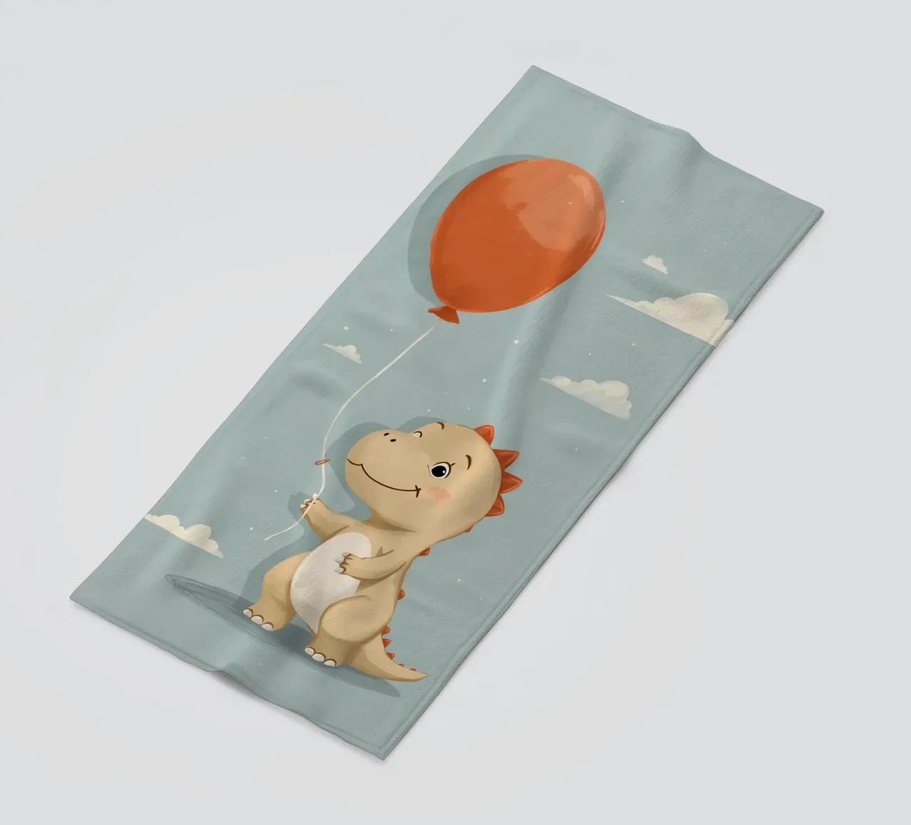 Dinosauro che tiene in mano un palloncino arancione con le nuvole telo mare da DesignDoodle