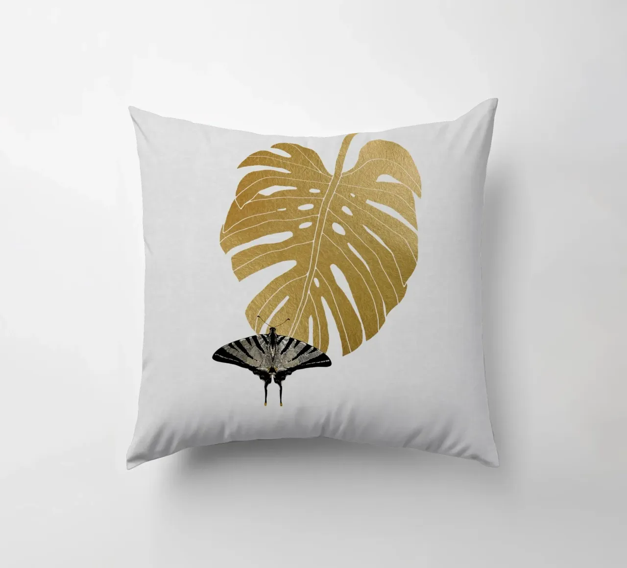 Farfalla e foglia di Monstera cuscino da Orara Studio