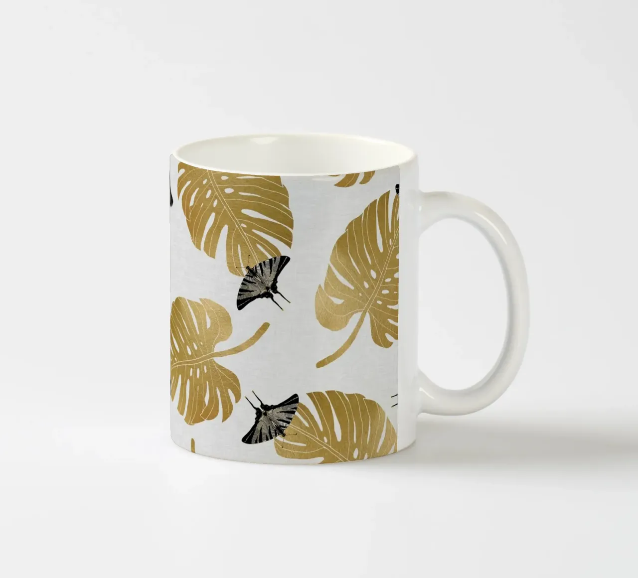 Farfalla e foglia di Monstera tazza in ceramica da Orara Studio