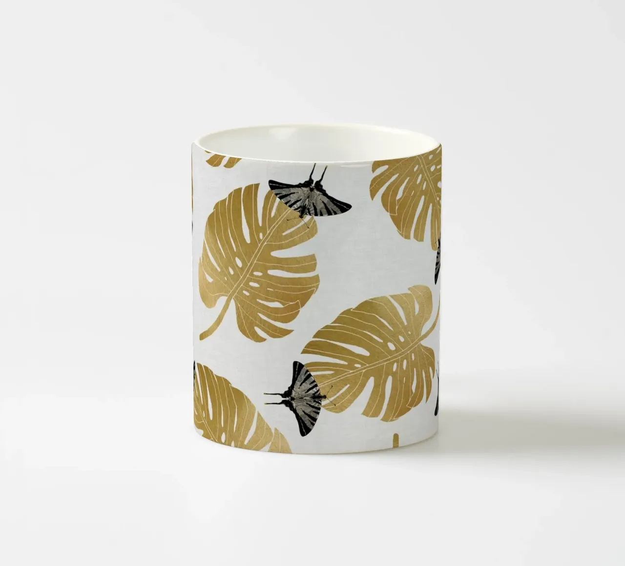 Farfalla e foglia di Monstera tazza in ceramica da Orara Studio