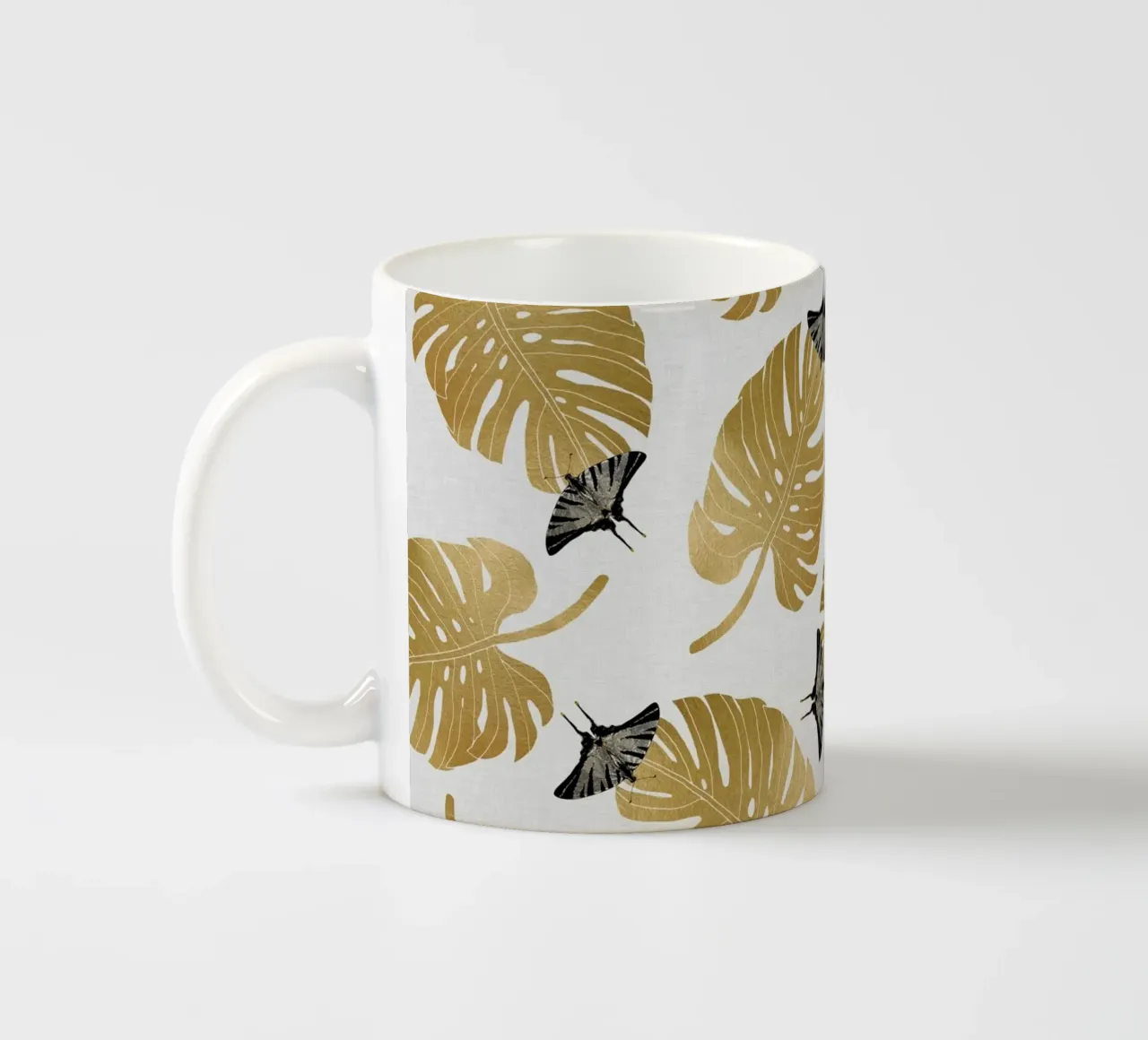 Farfalla e foglia di Monstera tazza in ceramica da Orara Studio
