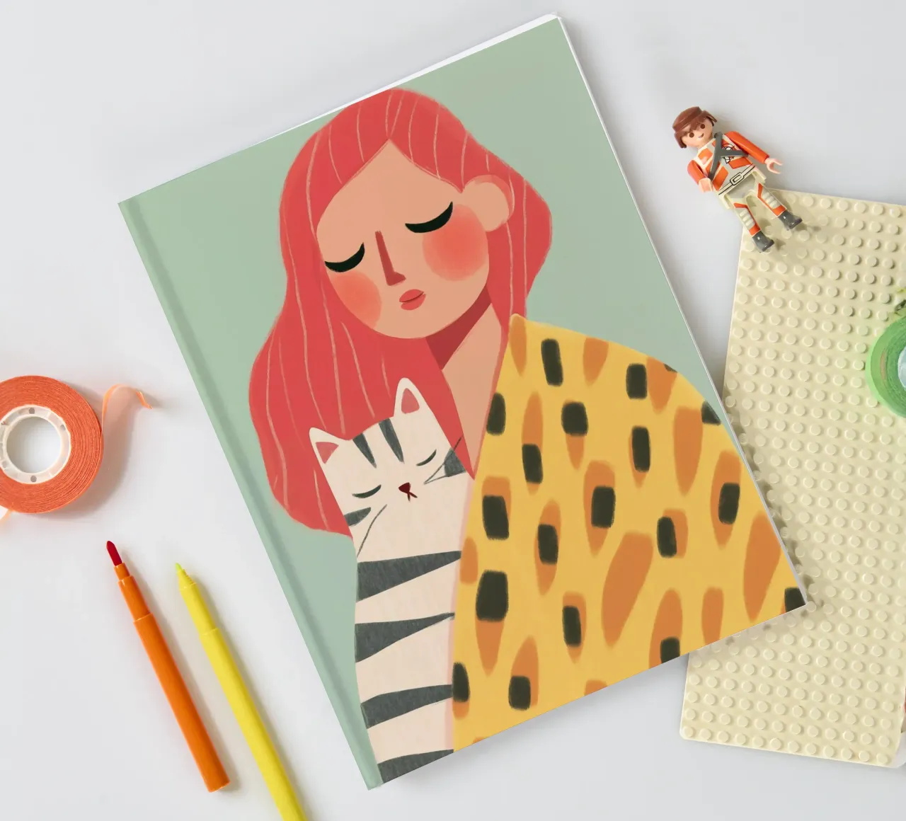 Red-haired woman with cat notebook by Autofocus
