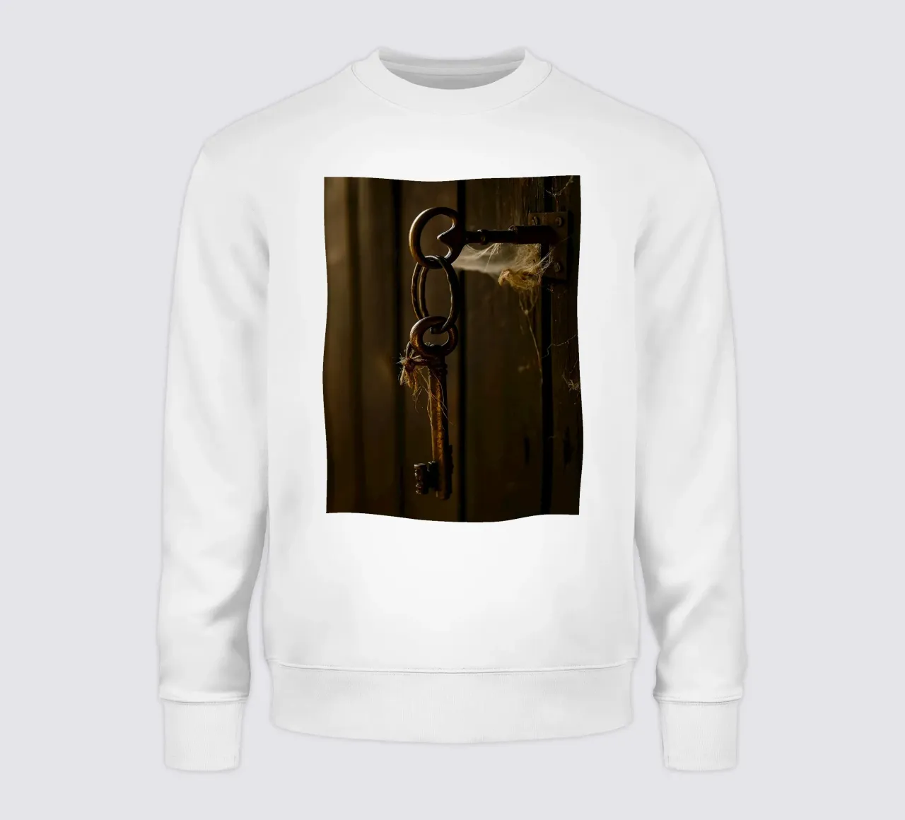 una chiave appesa a una vecchia porta felpa da PASMING