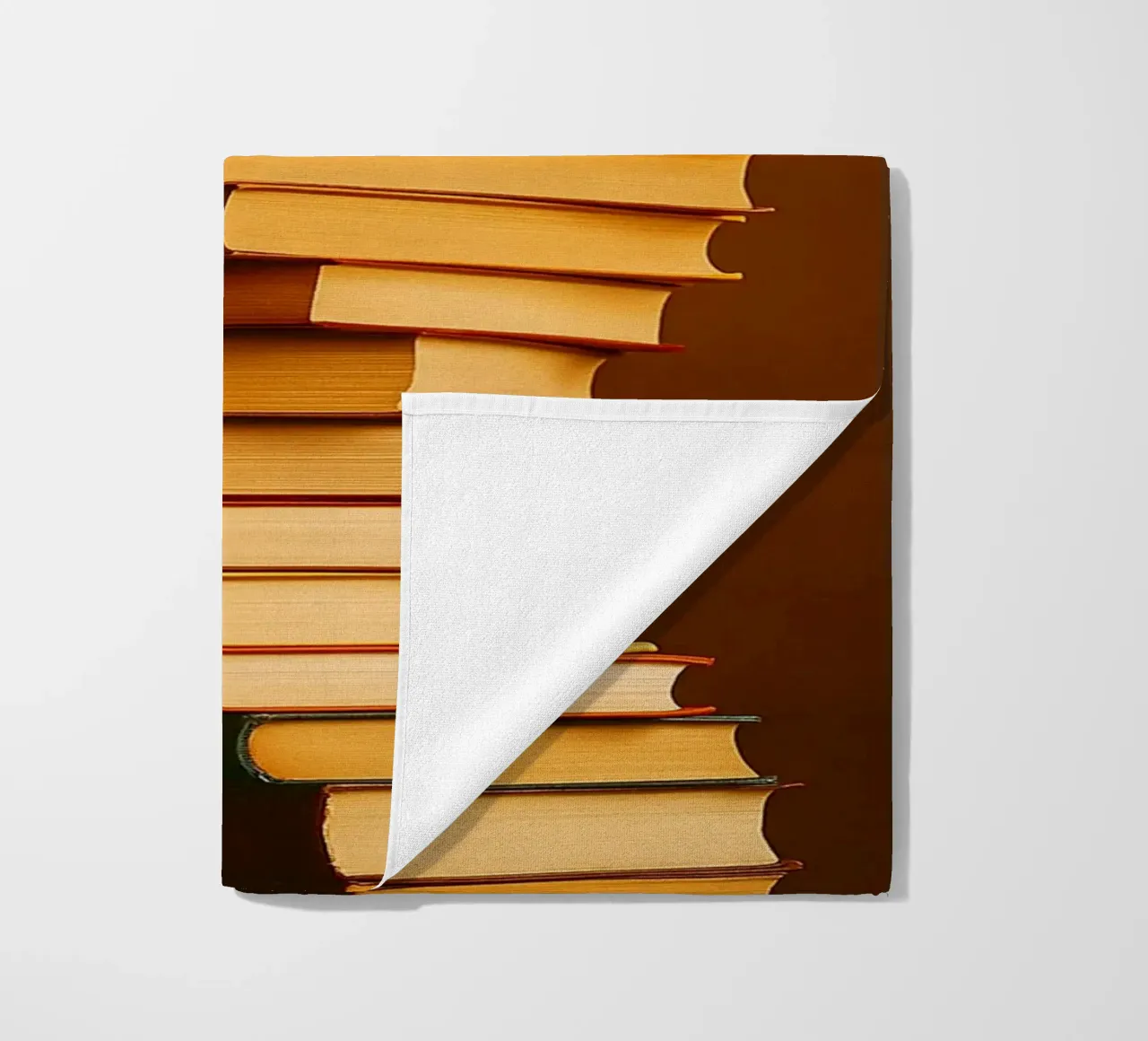 libri impilati telo mare da PASMING