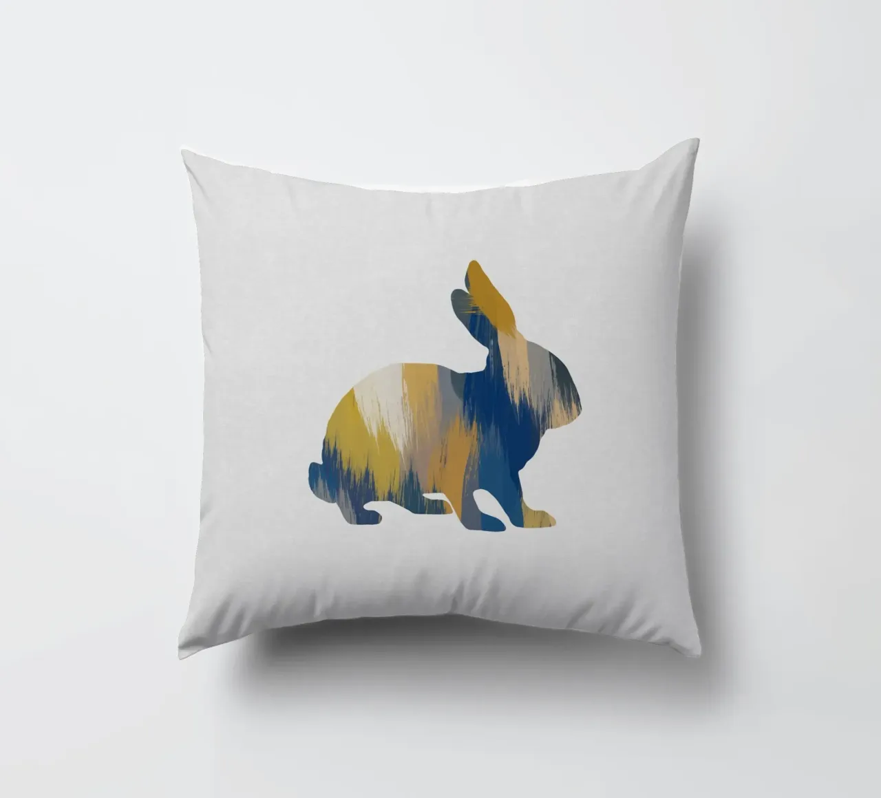 Lapin bleu et jaune coussin de Orara Studio