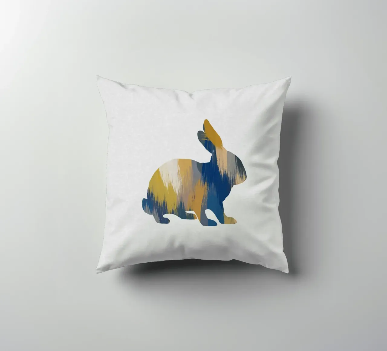 Lapin bleu et jaune coussin de Orara Studio