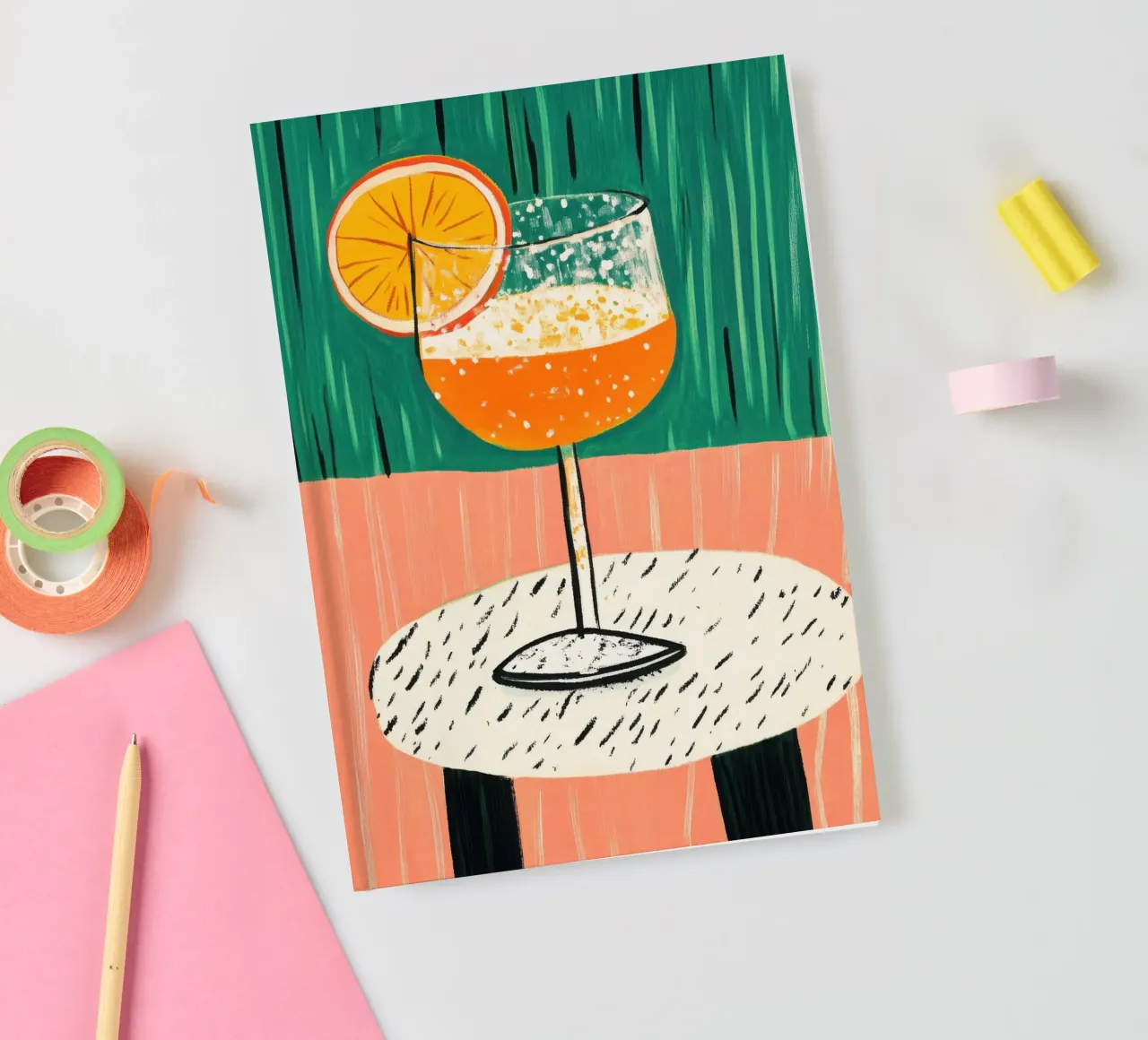 Refreshing drink on a white table notebook by Chic Lines Studio