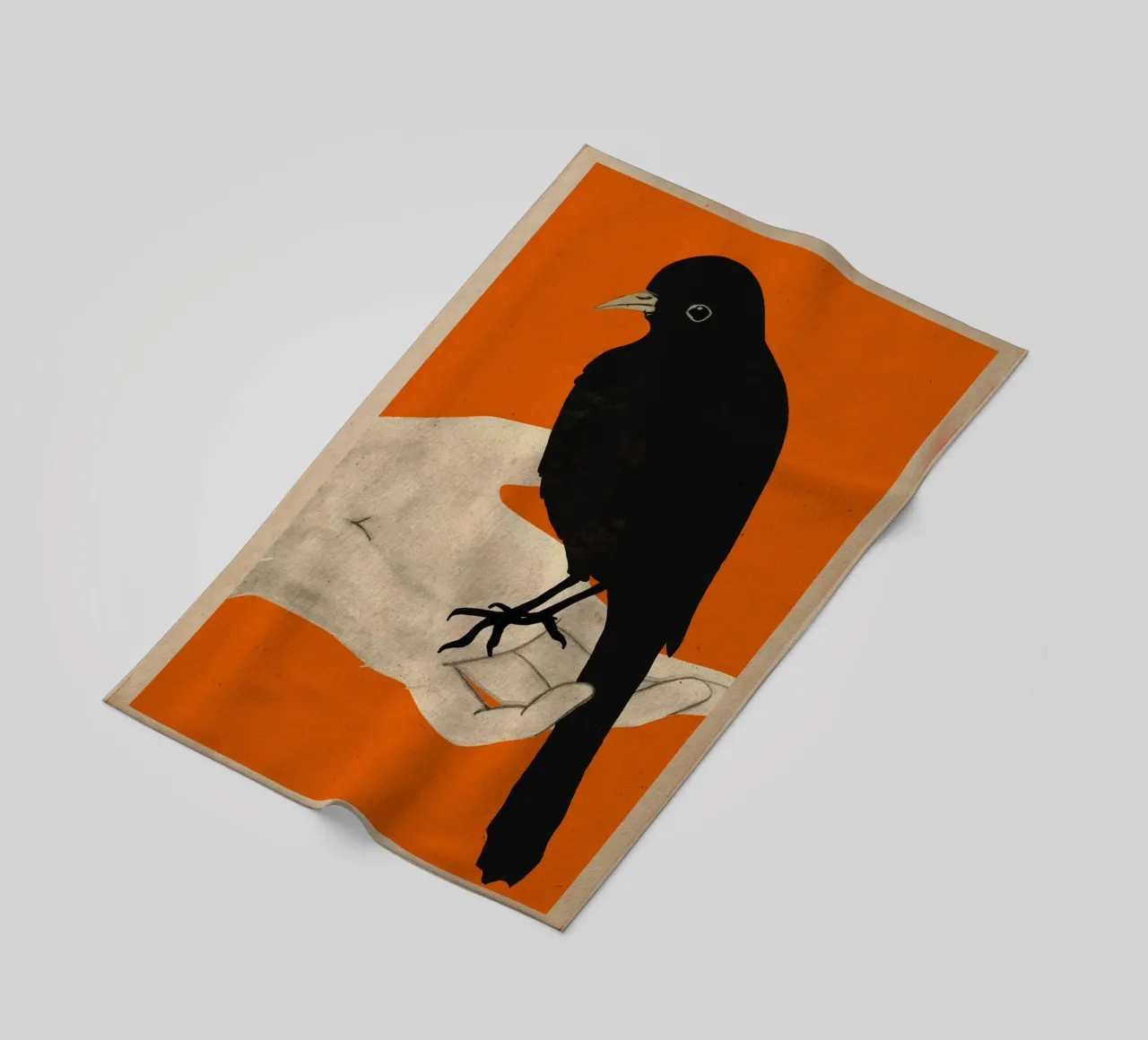 Uccello in mano telo mare da M.A.Z.U.N.