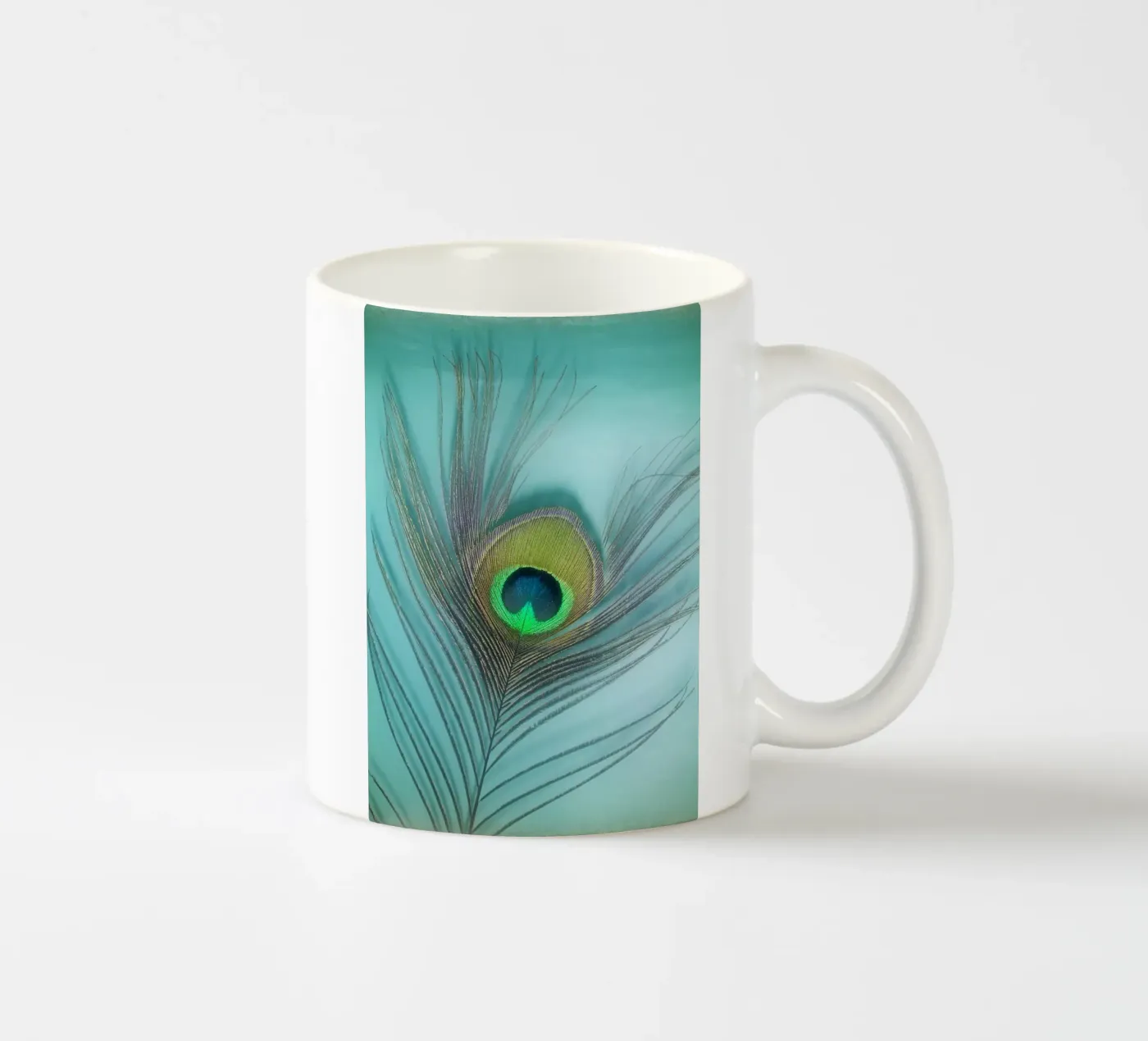 Peacock ceramic mug by Eva Nev Photography
