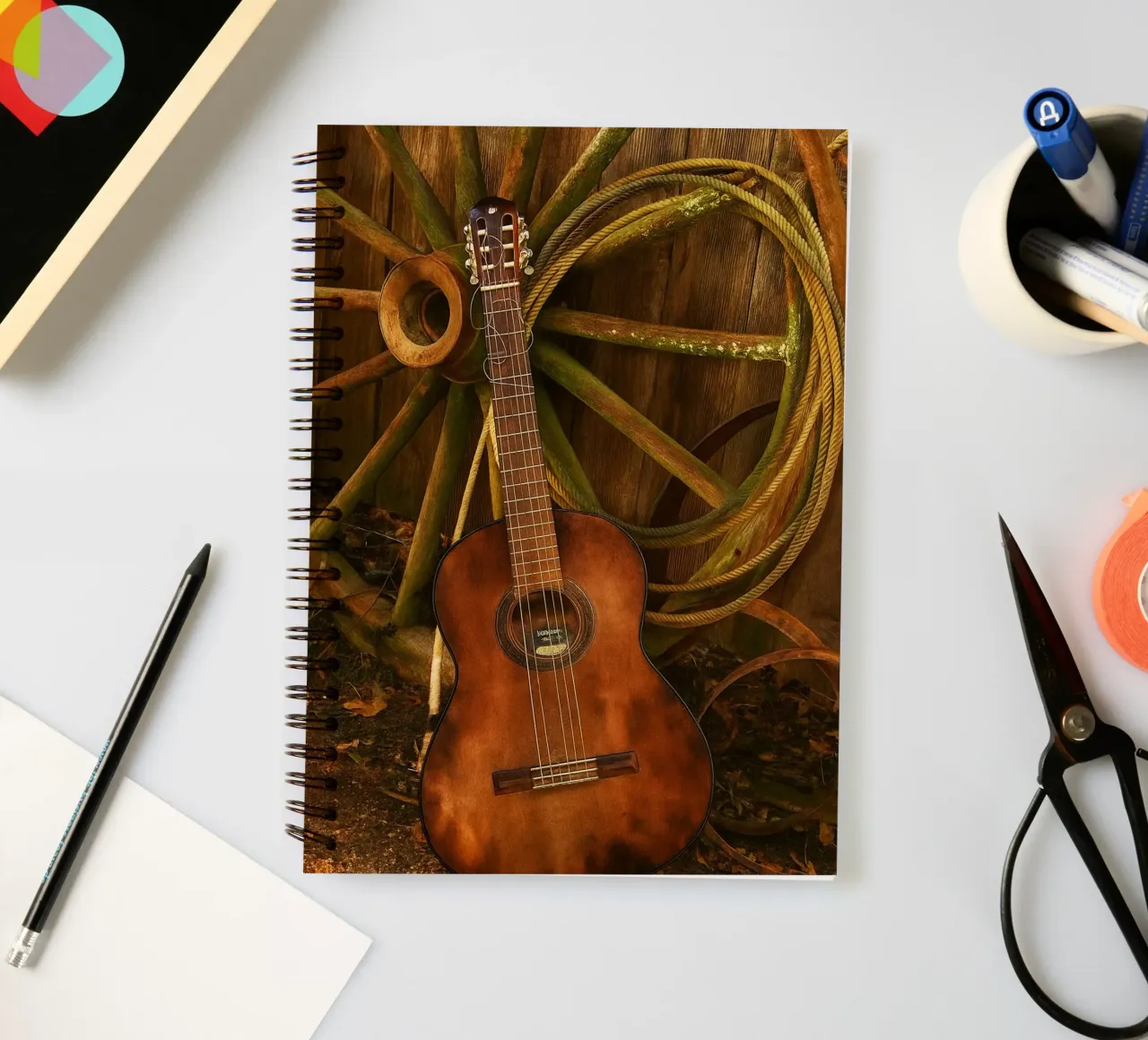 old guitar with broken strings spiral notebook by Deemoll