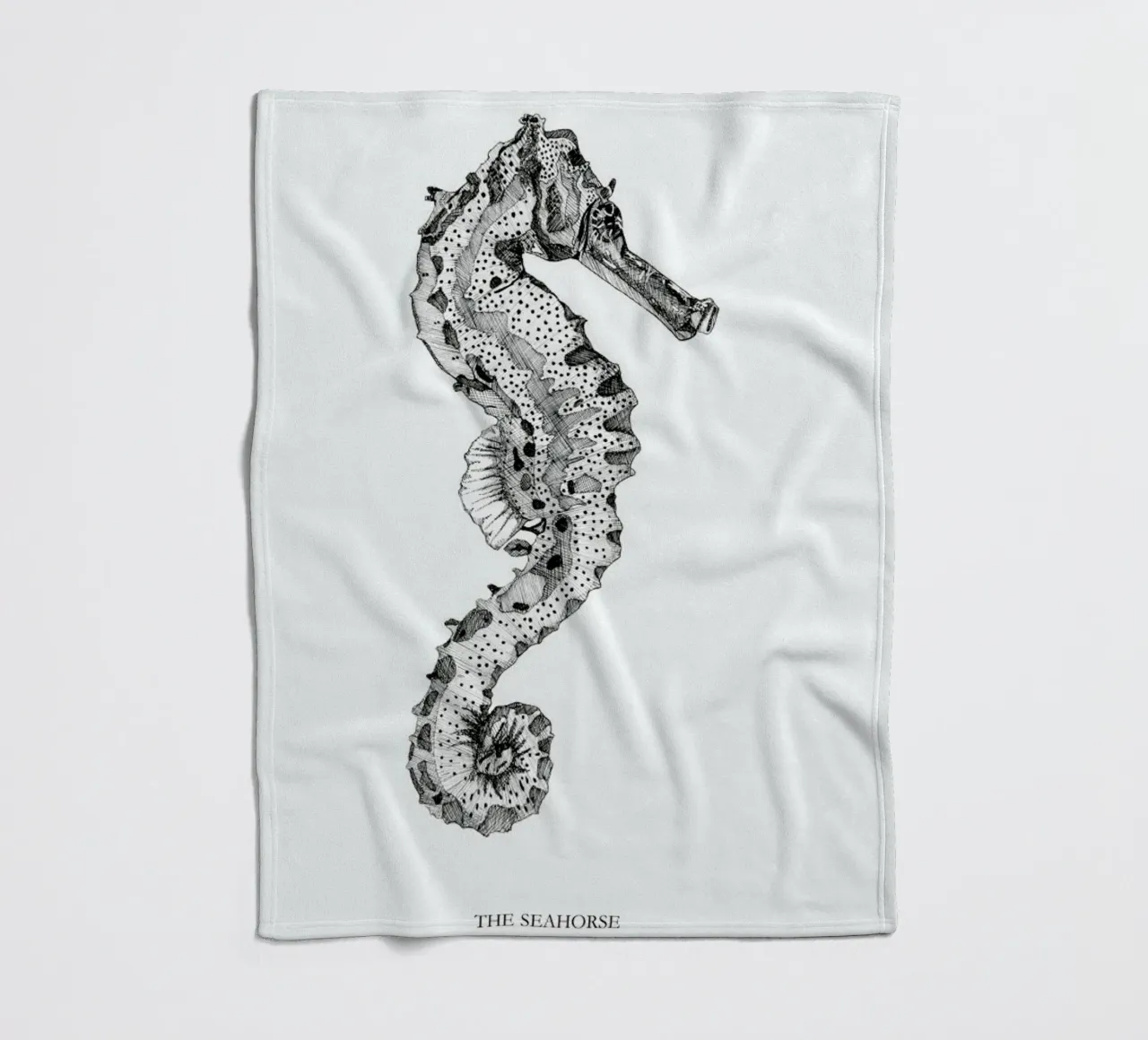 The Seahorse fleece blanket by Mathilde Olsen