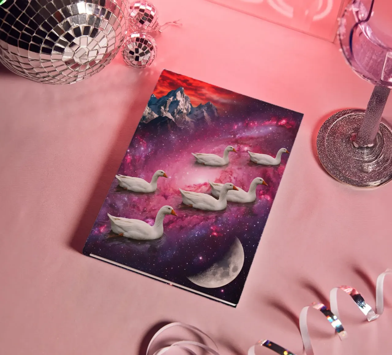 Cosmic Ducks Floating Through a Vibrant Galaxy Scene notebook by Cosmic Reverie Studio