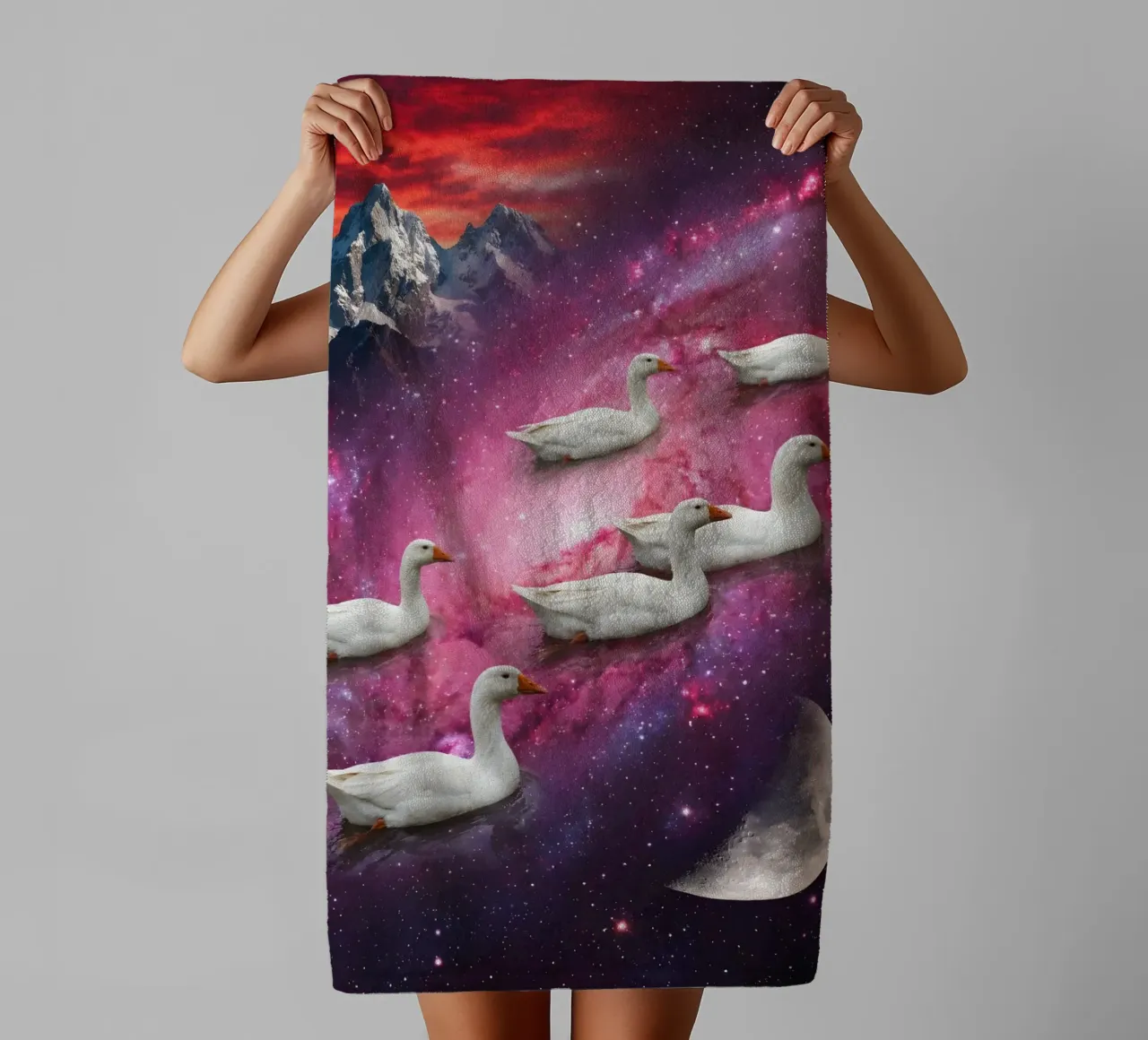 Cosmic Ducks Floating Through a Vibrant Galaxy Scene towel by Cosmic Reverie Studio
