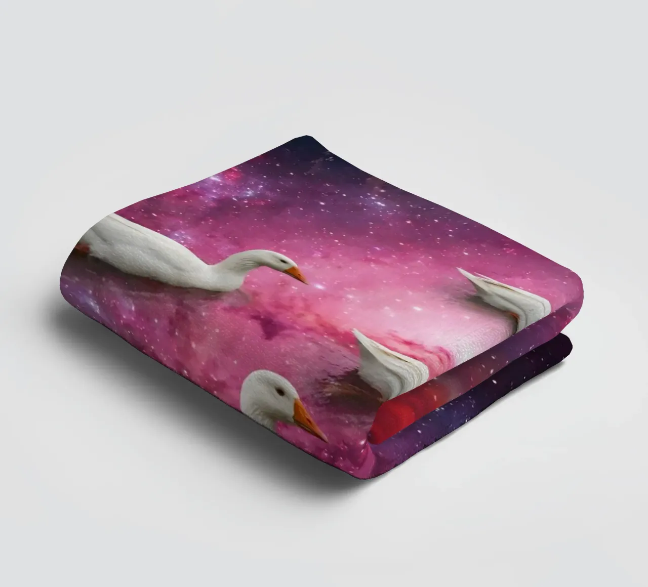 Cosmic Ducks Floating Through a Vibrant Galaxy Scene towel by Cosmic Reverie Studio