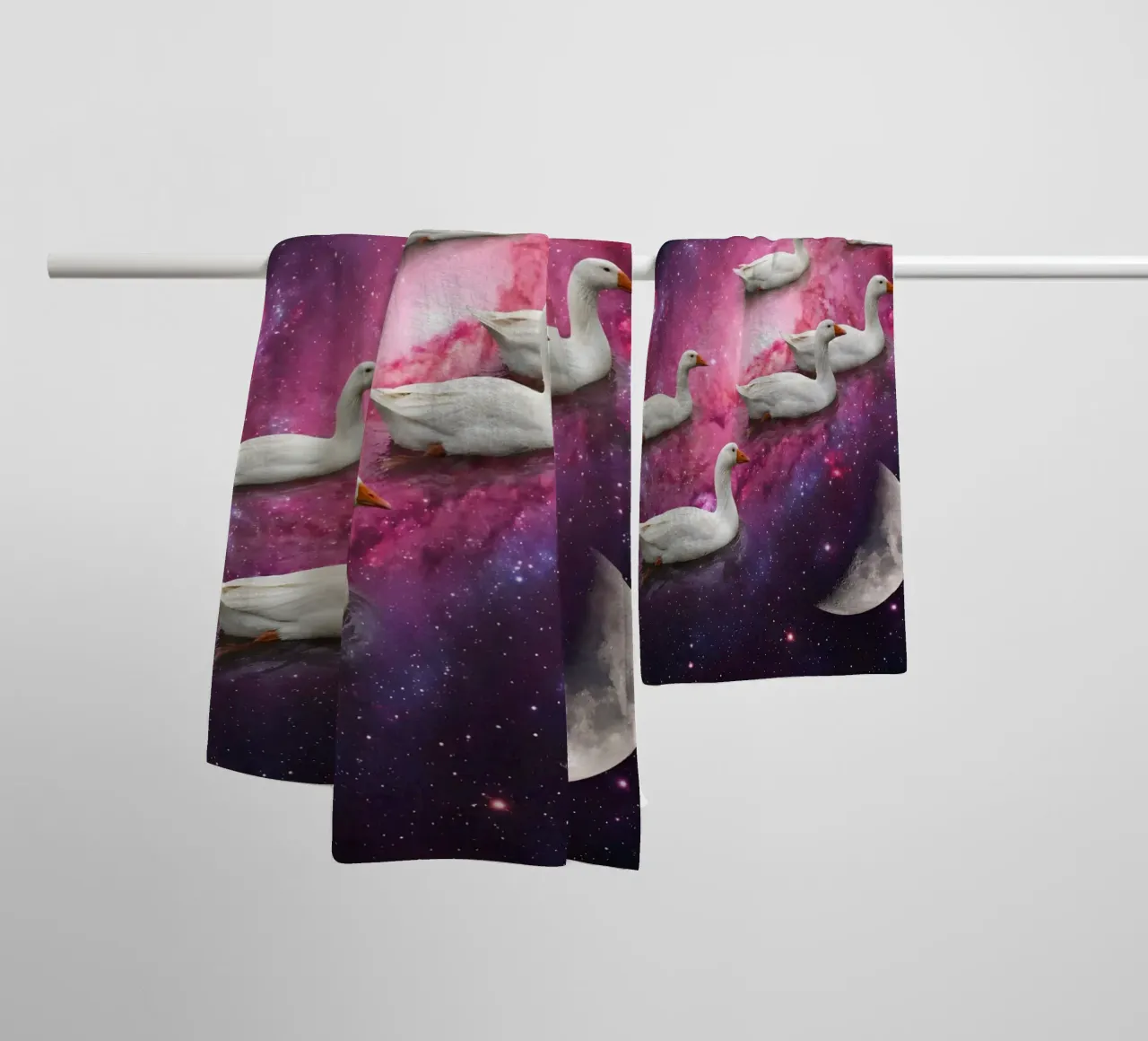 Cosmic Ducks Floating Through a Vibrant Galaxy Scene towel by Cosmic Reverie Studio