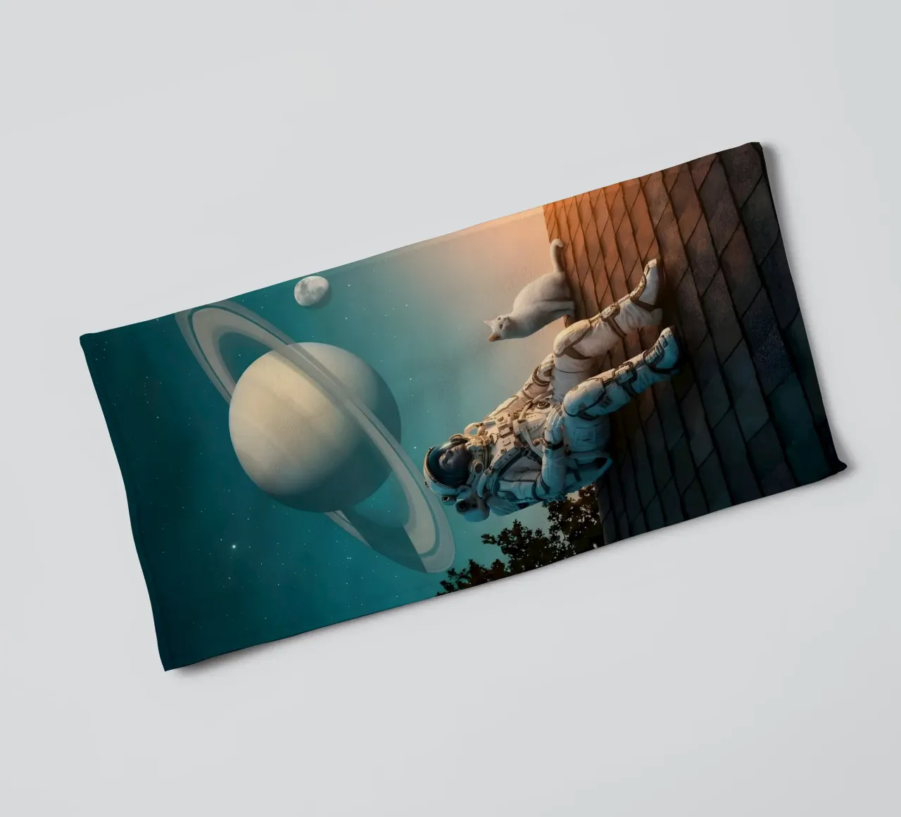 Cosmic Dreamer: Astronaut and Cat Under Saturn Sky towel by Cosmic Reverie Studio