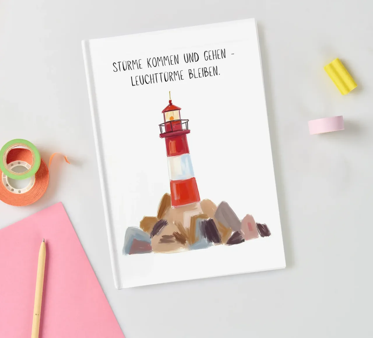 Red and white lighthouse with slogan notebook by Coastal Art