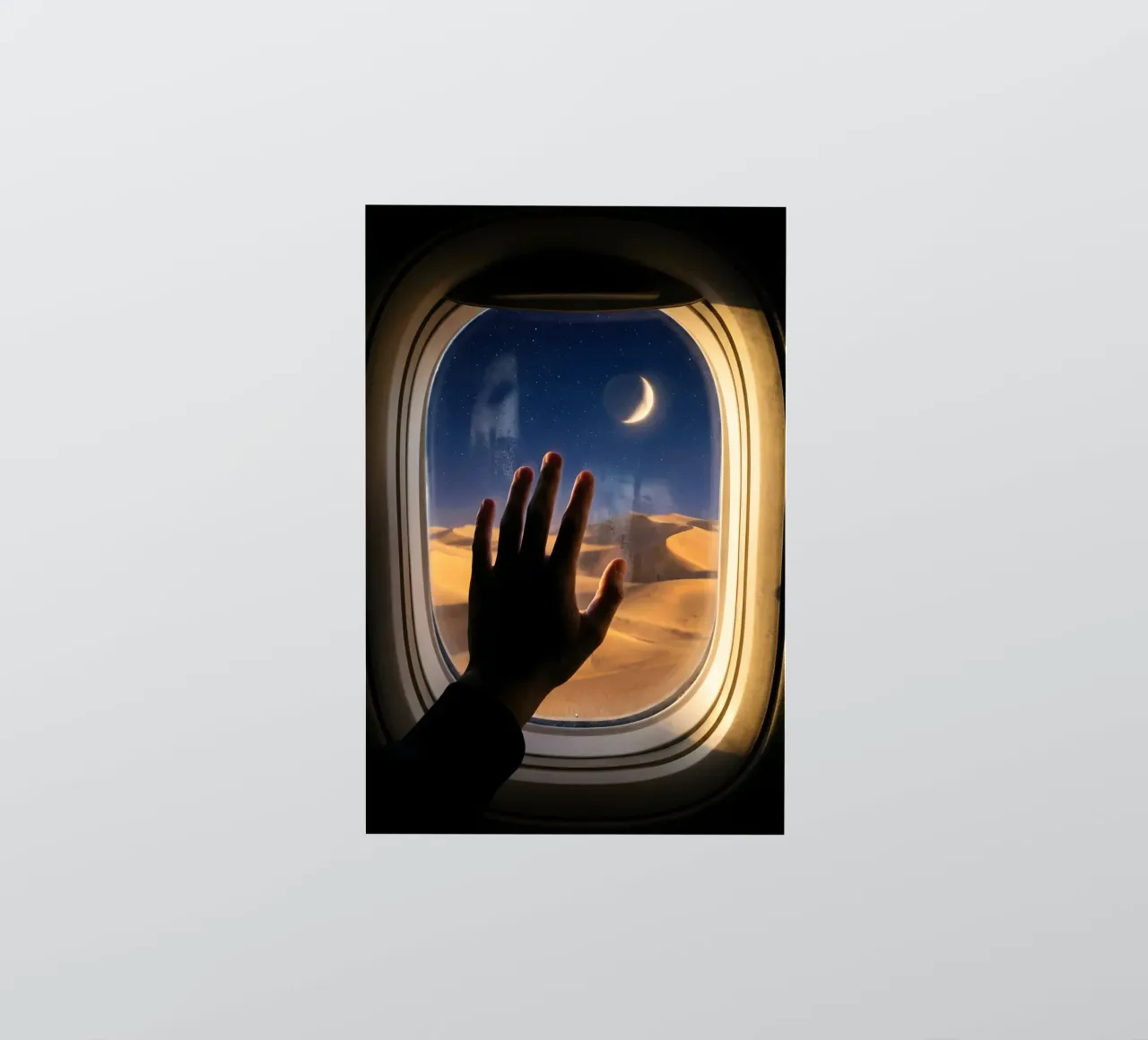 Vue du désert au clair de lune à partir d'une fenêtre d'avion autocollant de Dreamspace Visuals