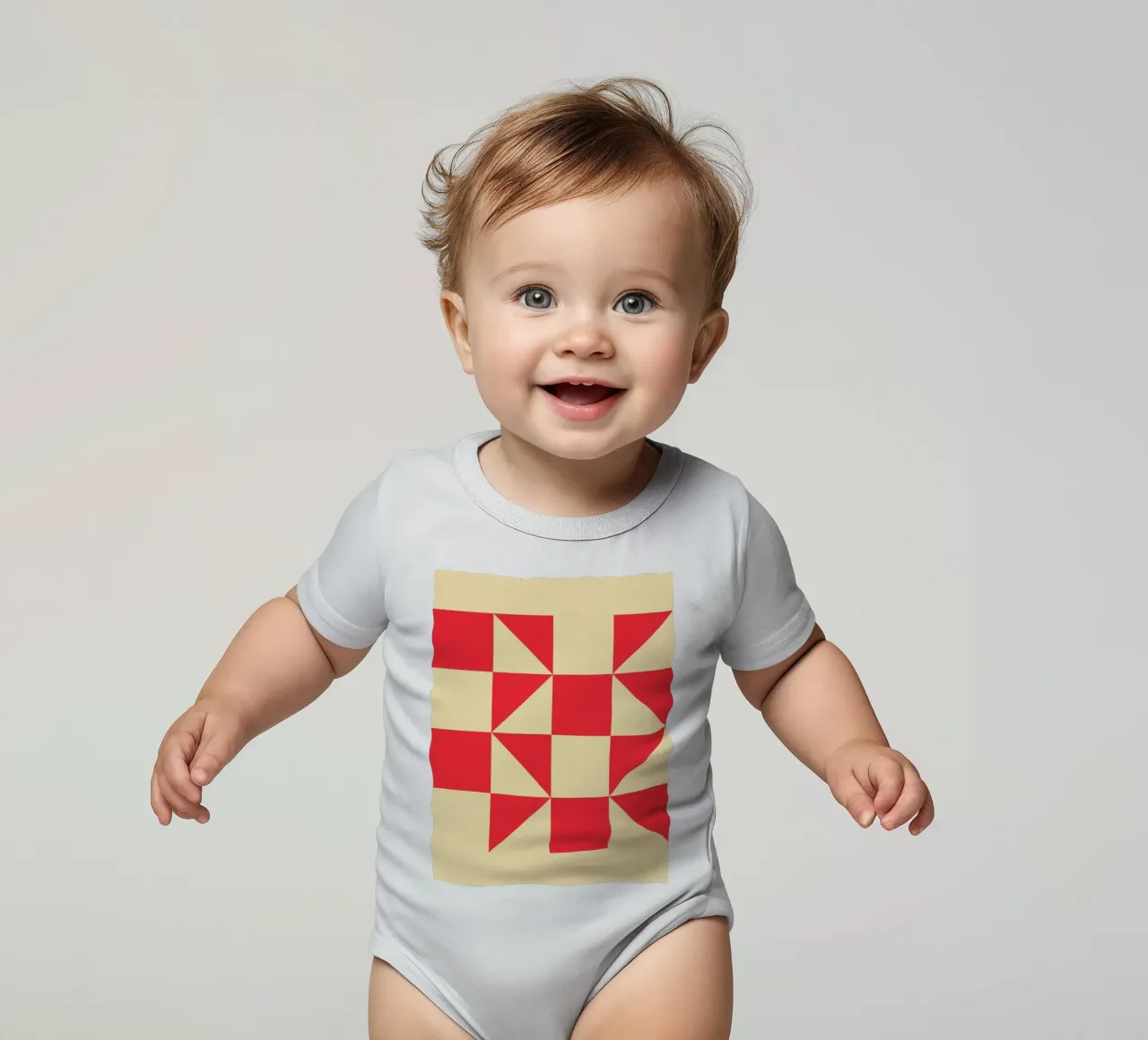 Abstract Bauhaus triangular pattern in red and cream short-sleeve baby romper by Casa Vibes