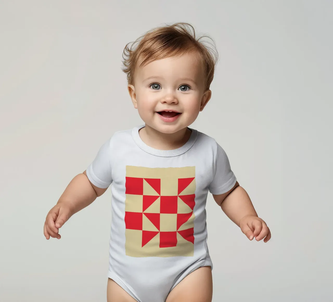 Abstract Bauhaus triangular pattern in red and cream short-sleeve baby romper by Casa Vibes