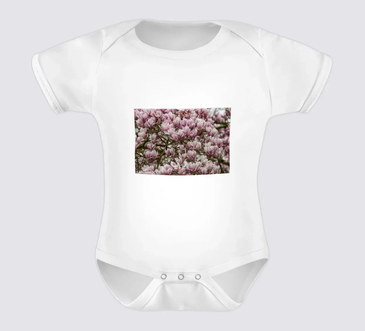 Pink Magnolia's short-sleeve baby romper by Curious Collections by Marielle Leenders