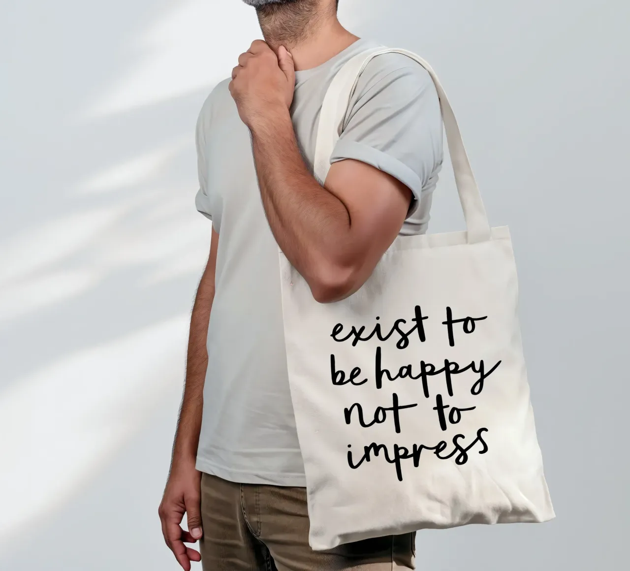 Exist to Be Happy not to Impress Typografie Design tote bag by THE MOTIVATED TYPE