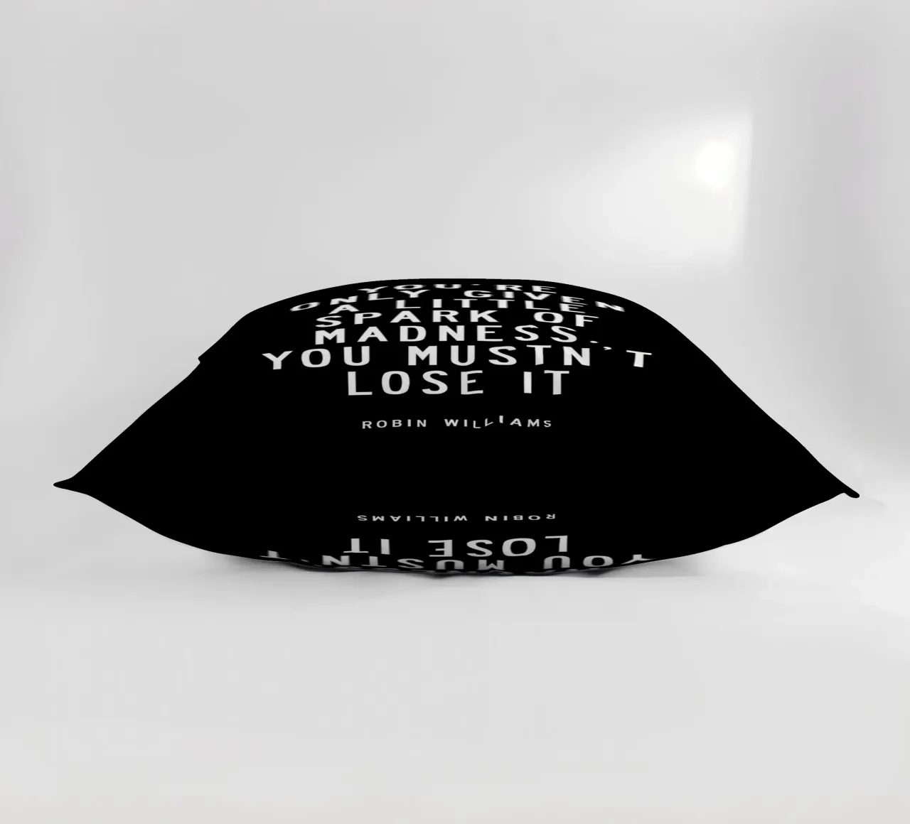 Ti viene data solo una piccola scintilla di follia Typografie cuscino da THE MOTIVATED TYPE