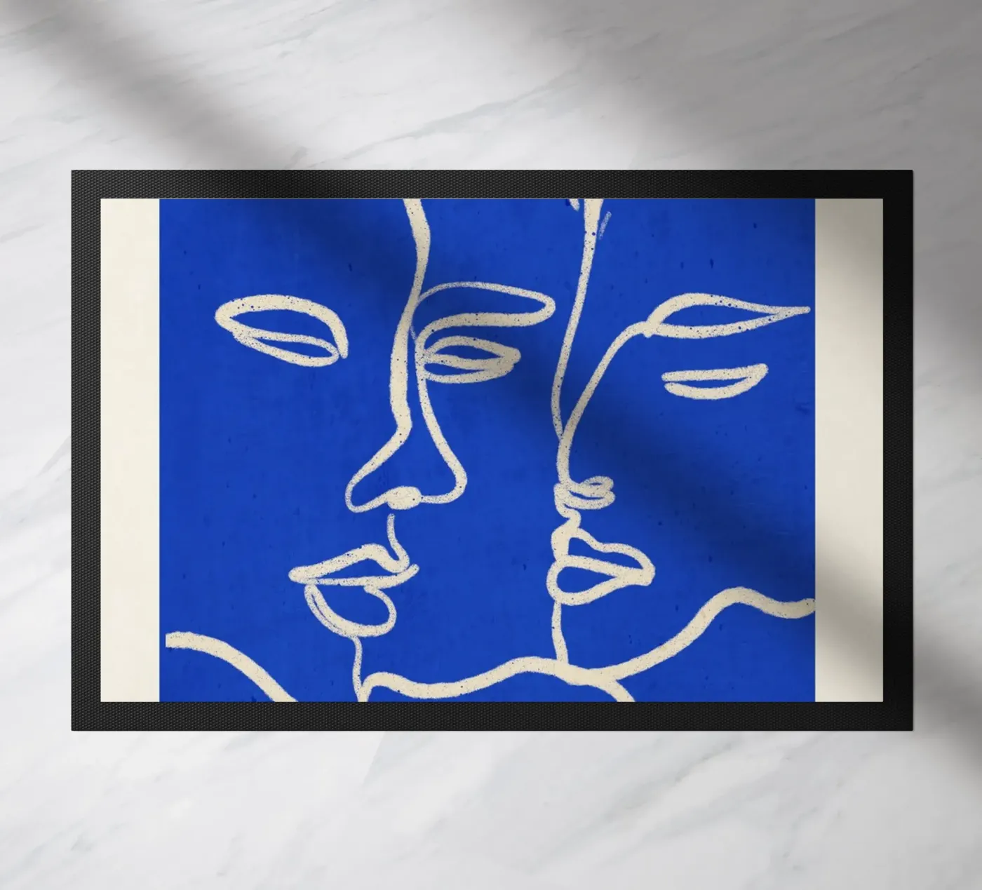 Trois visages paillasson de ThingDesign