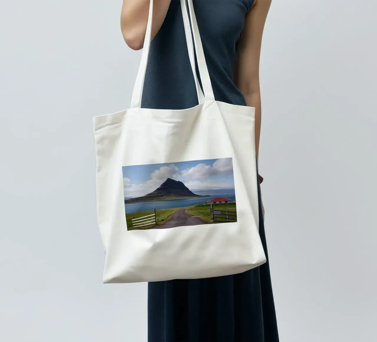 Mountain in Iceland by the sea tote bag by Fjöllart