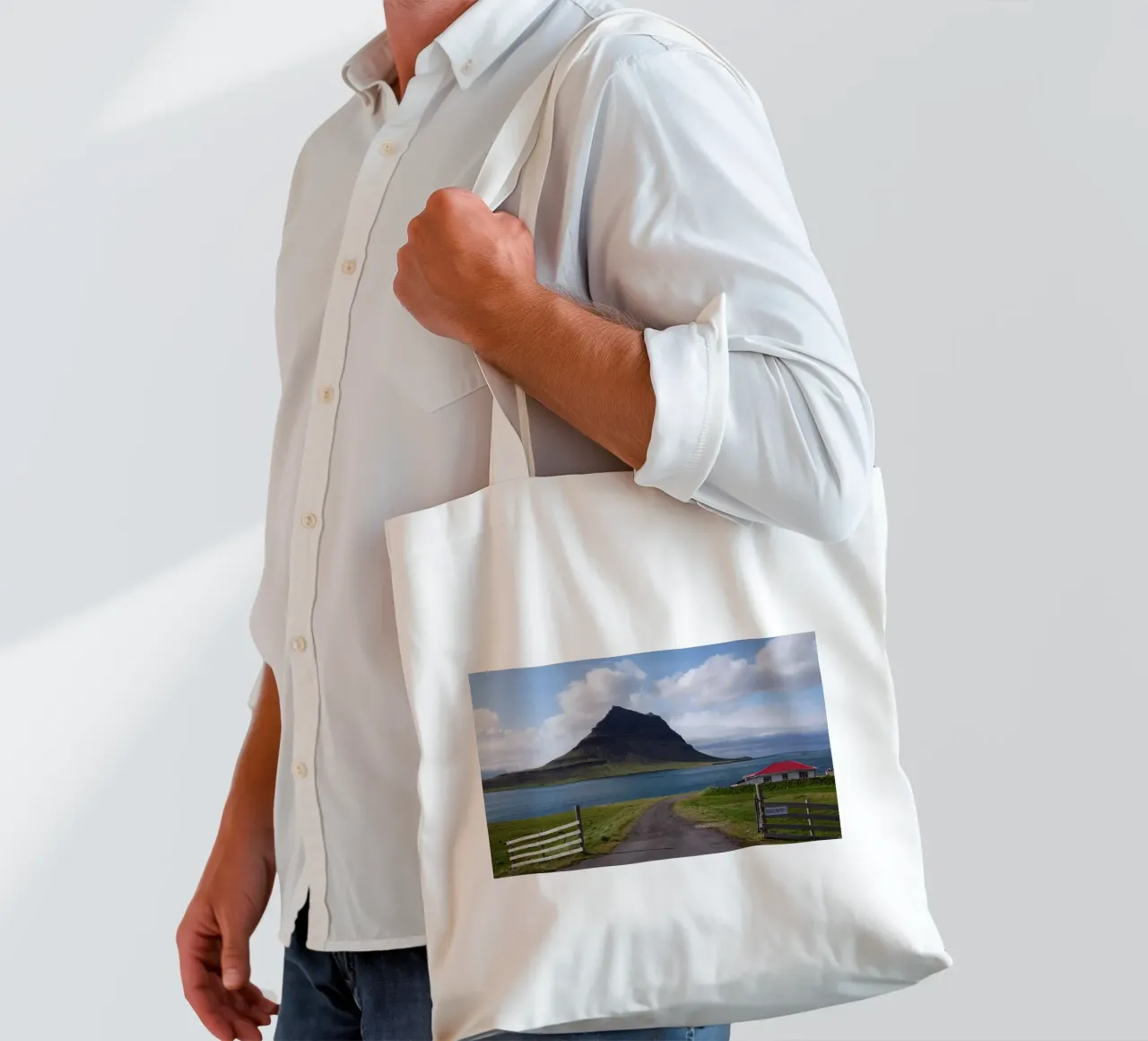 Mountain in Iceland by the sea tote bag by Fjöllart