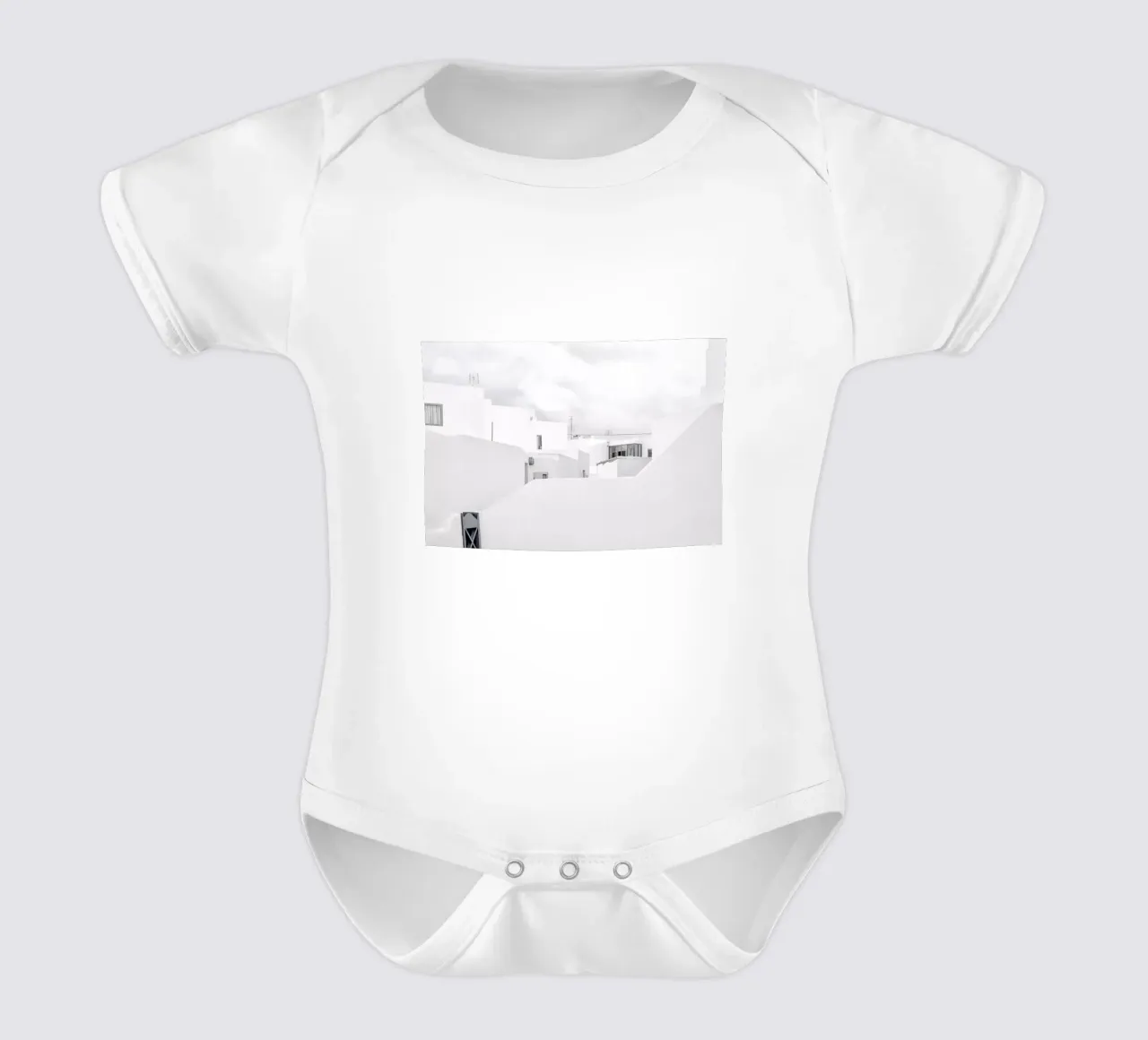White Village short-sleeve baby romper by Amy & Kurt