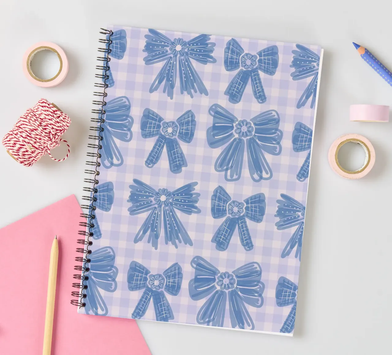 Blue Bows Gingham Pattern spiral notebook by anisillustration