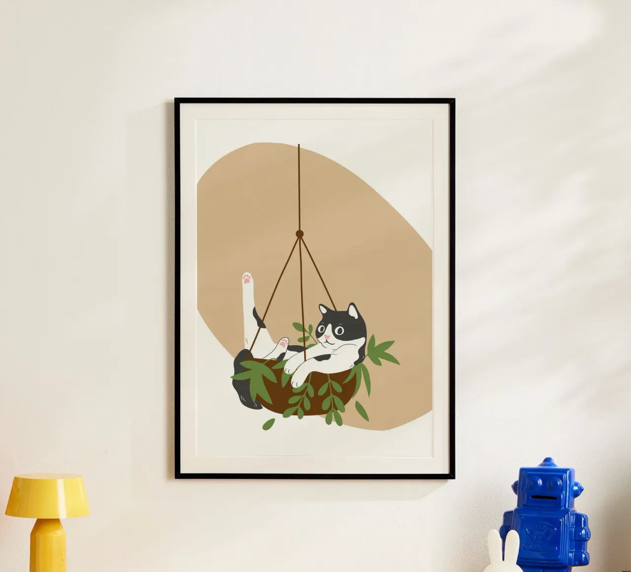 black and white cat playfully lounges in a hanging carta hahnemühle da LisaArtes