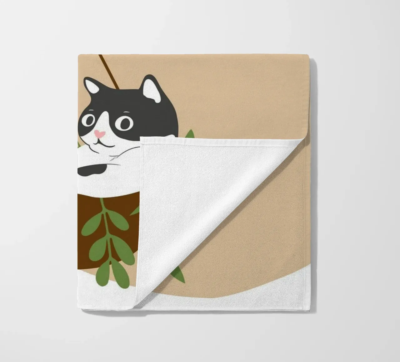 black and white cat playfully lounges in a hanging telo mare da LisaArtes