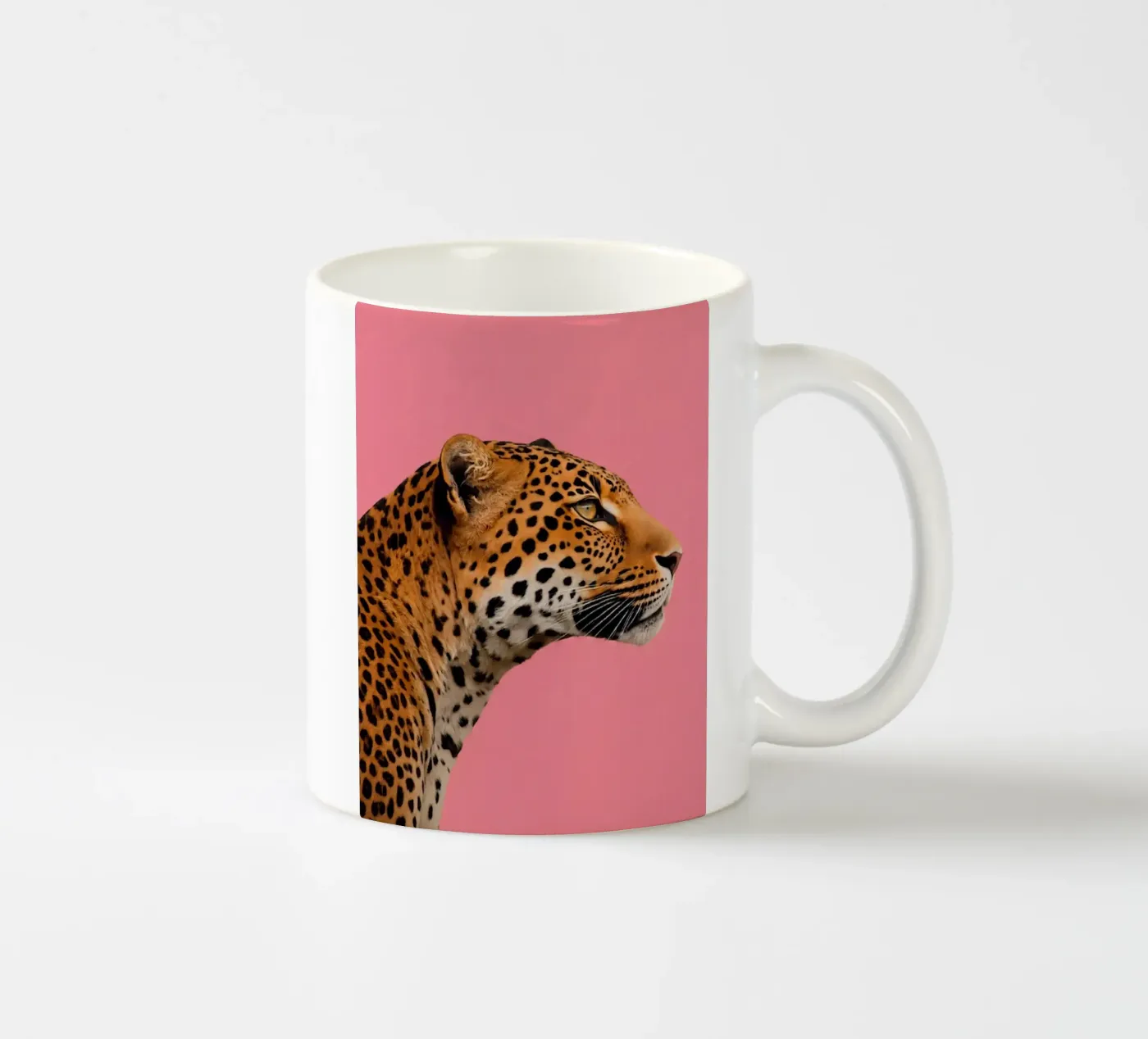 Leopard pink background ceramic mug by Eliban